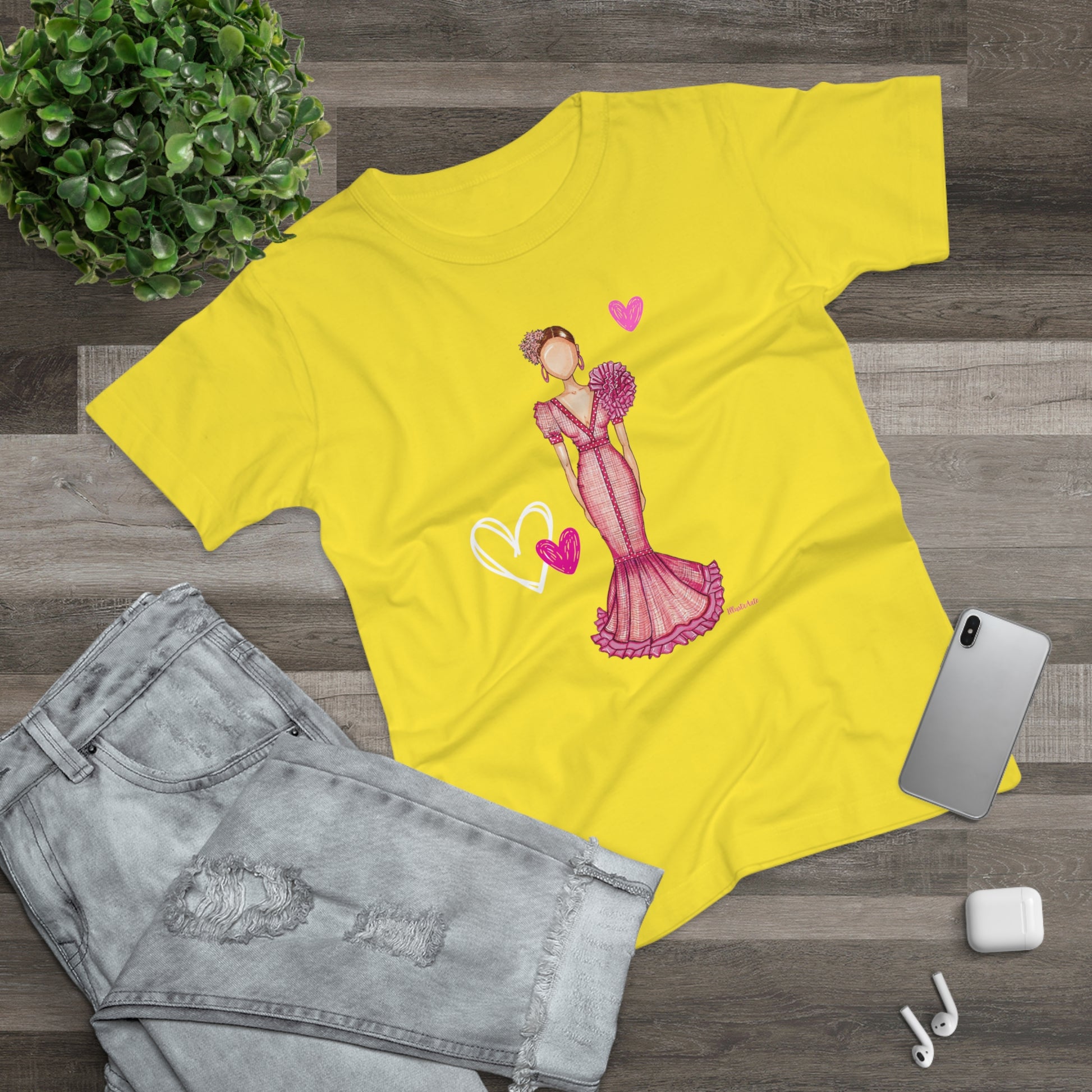 a yellow t - shirt with a picture of a woman in a pink dress