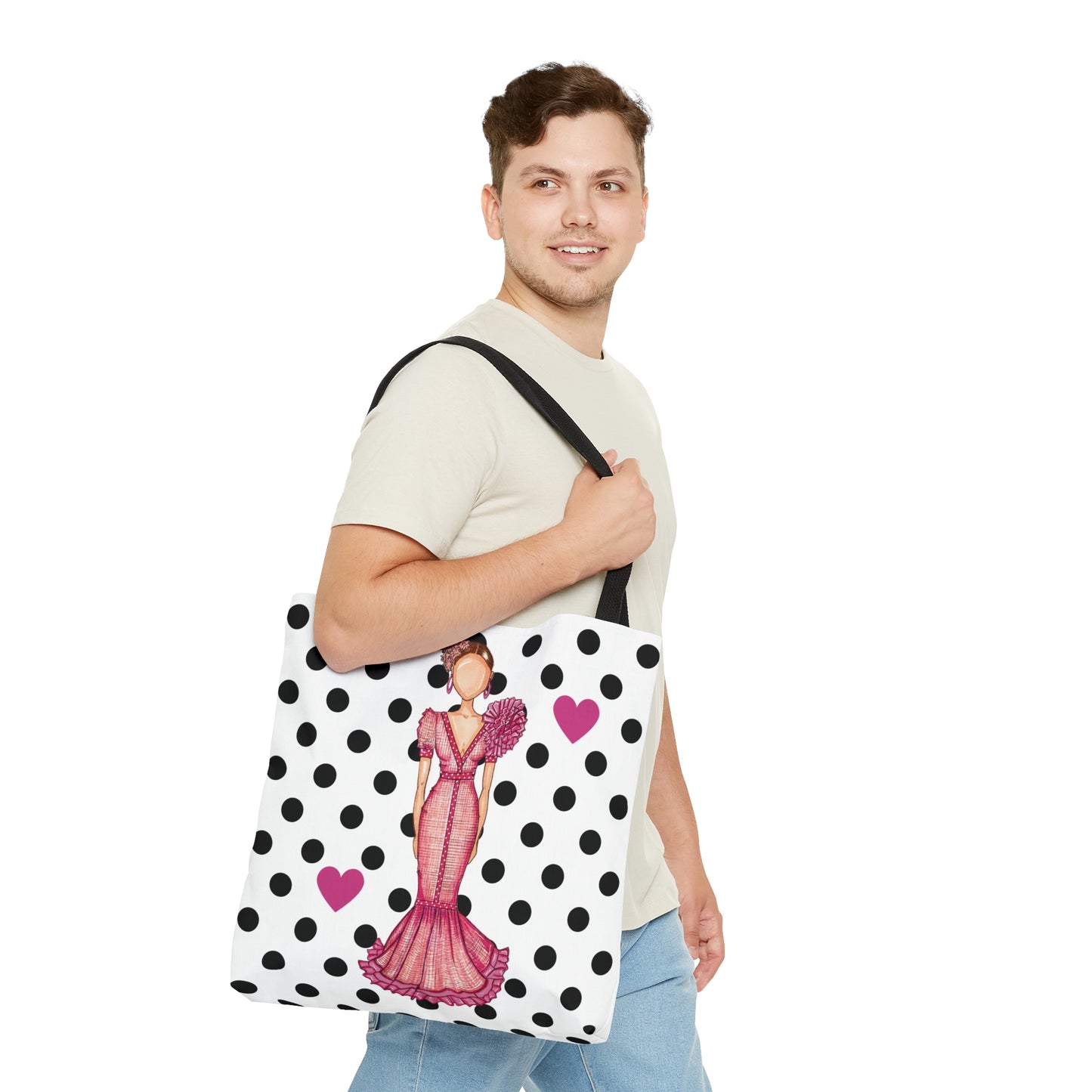a man holding a polka dot bag with a woman on it