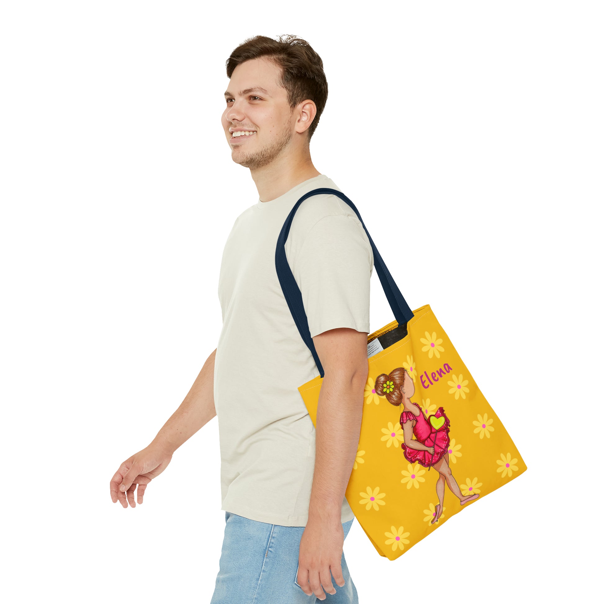 a man carrying a yellow bag with a picture of a woman on it