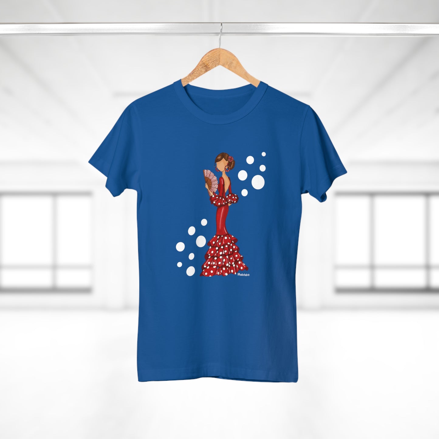 a blue t - shirt with an image of a woman in a red dress