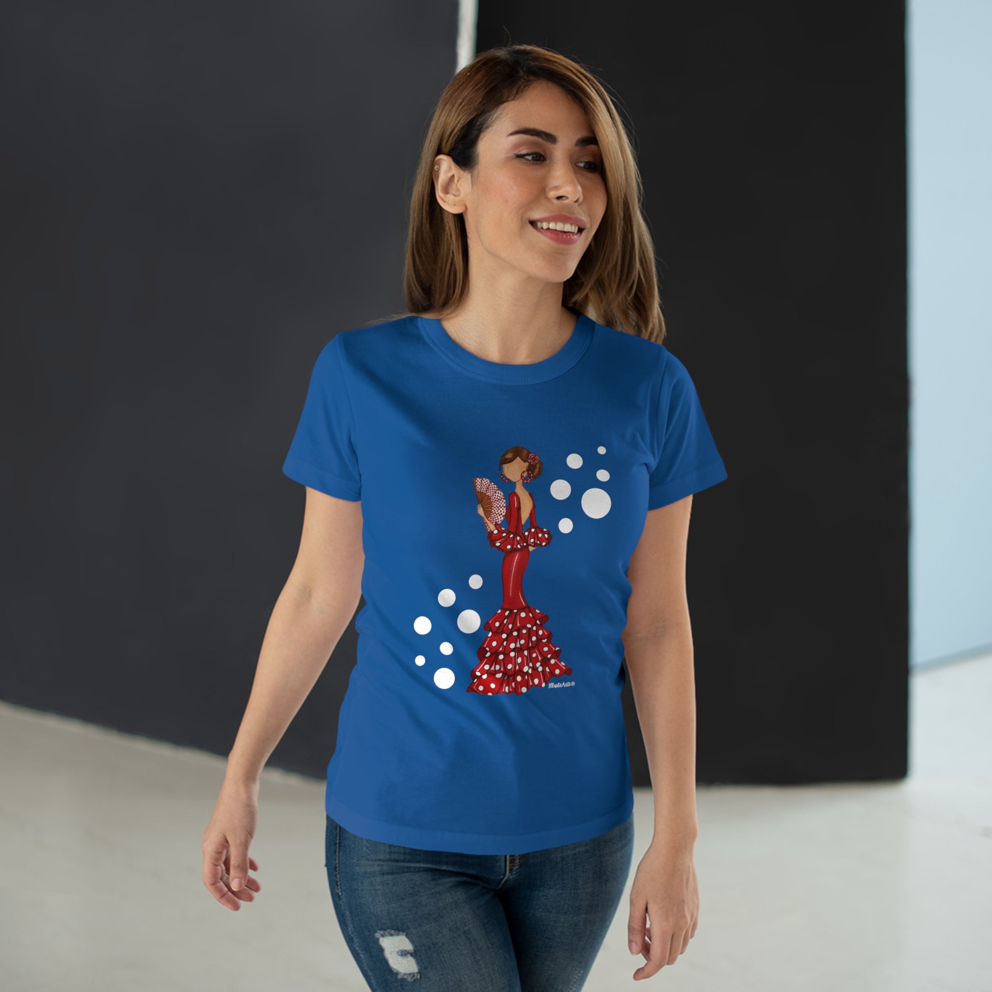 a woman wearing a blue t - shirt with a picture of a woman on it