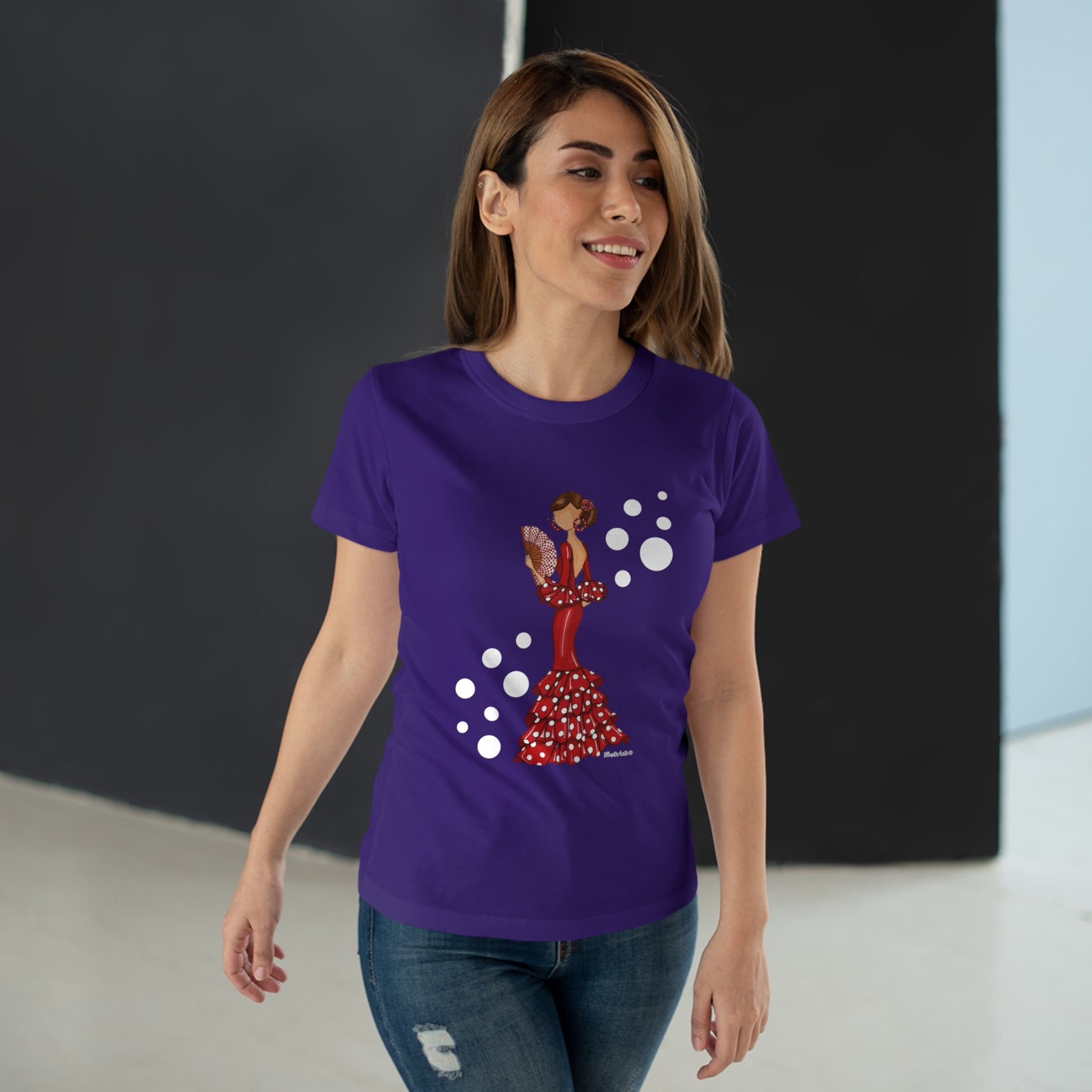 a woman wearing a purple t - shirt with a picture of a woman on it