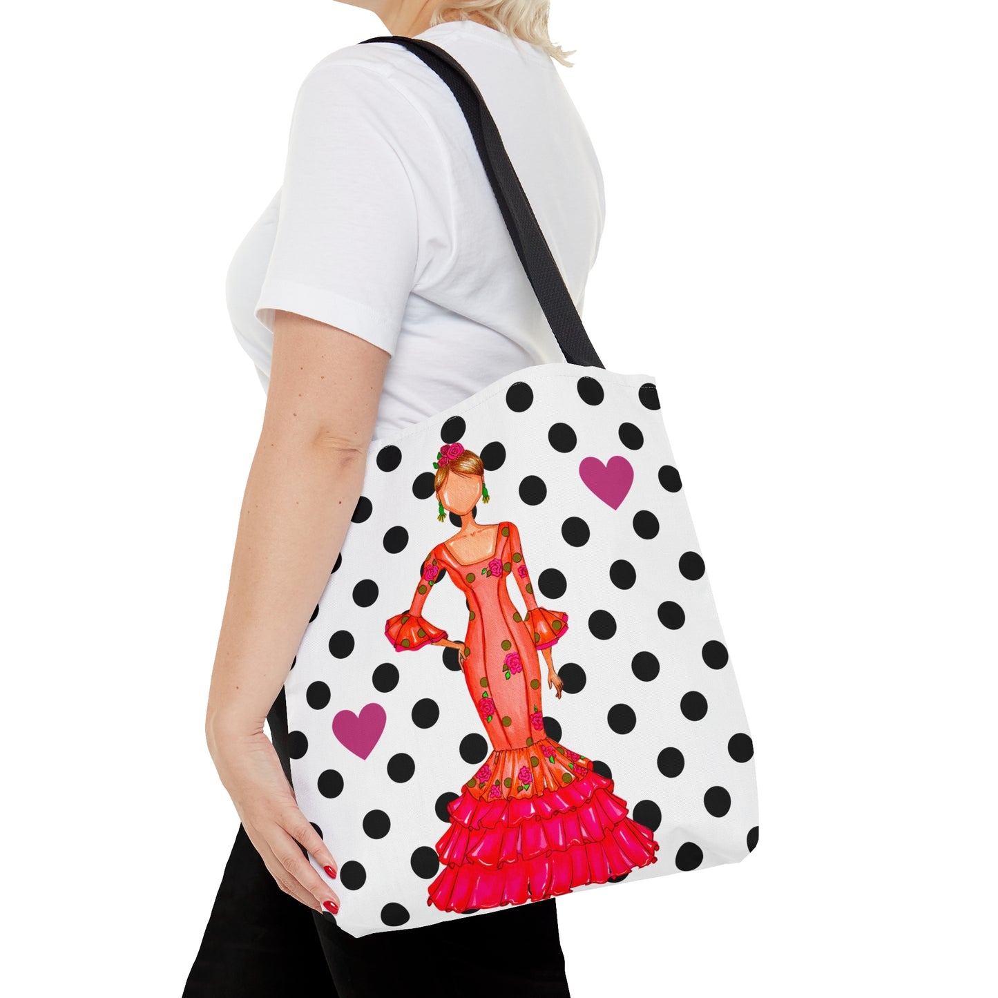 a woman is carrying a polka dot purse