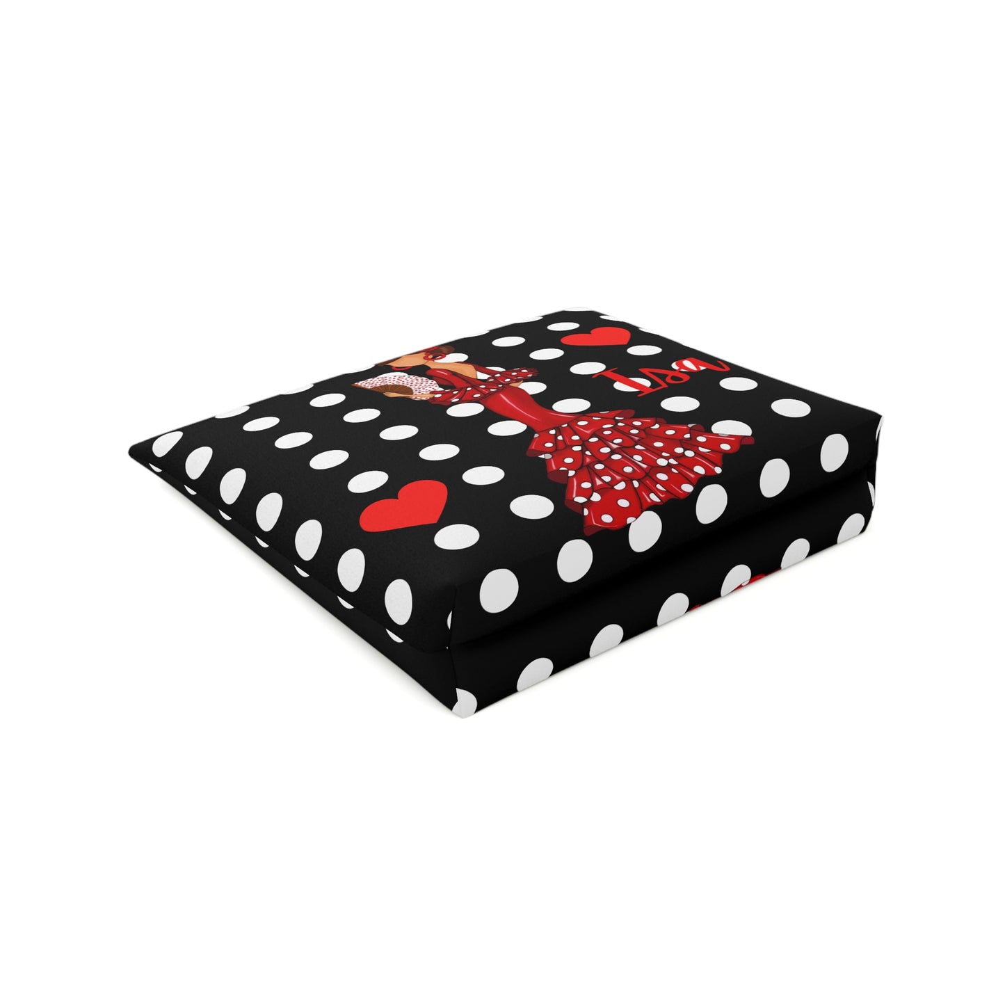 a black and white polka dot blanket with a red bow