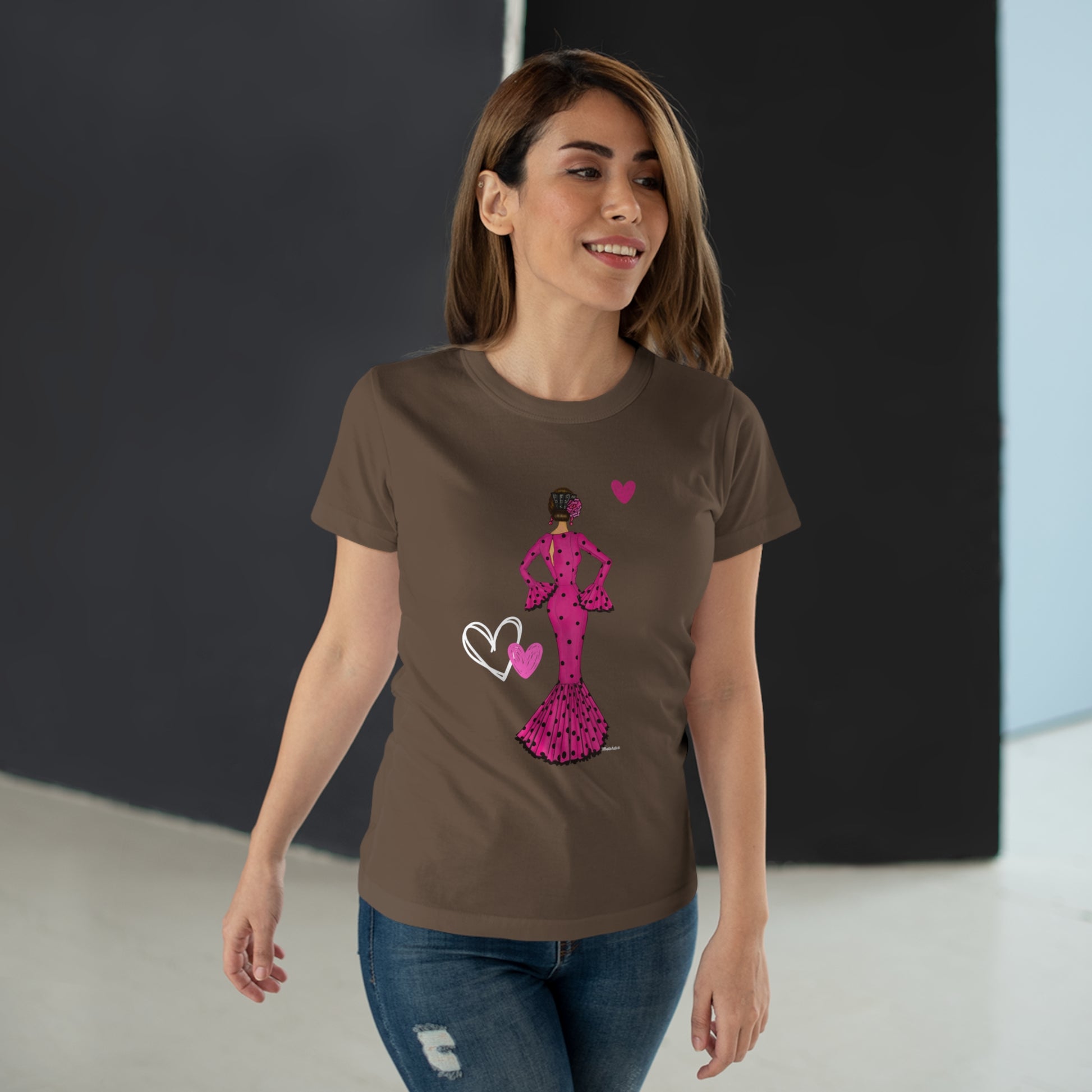 a woman wearing a t - shirt with a pink minnie mouse on it