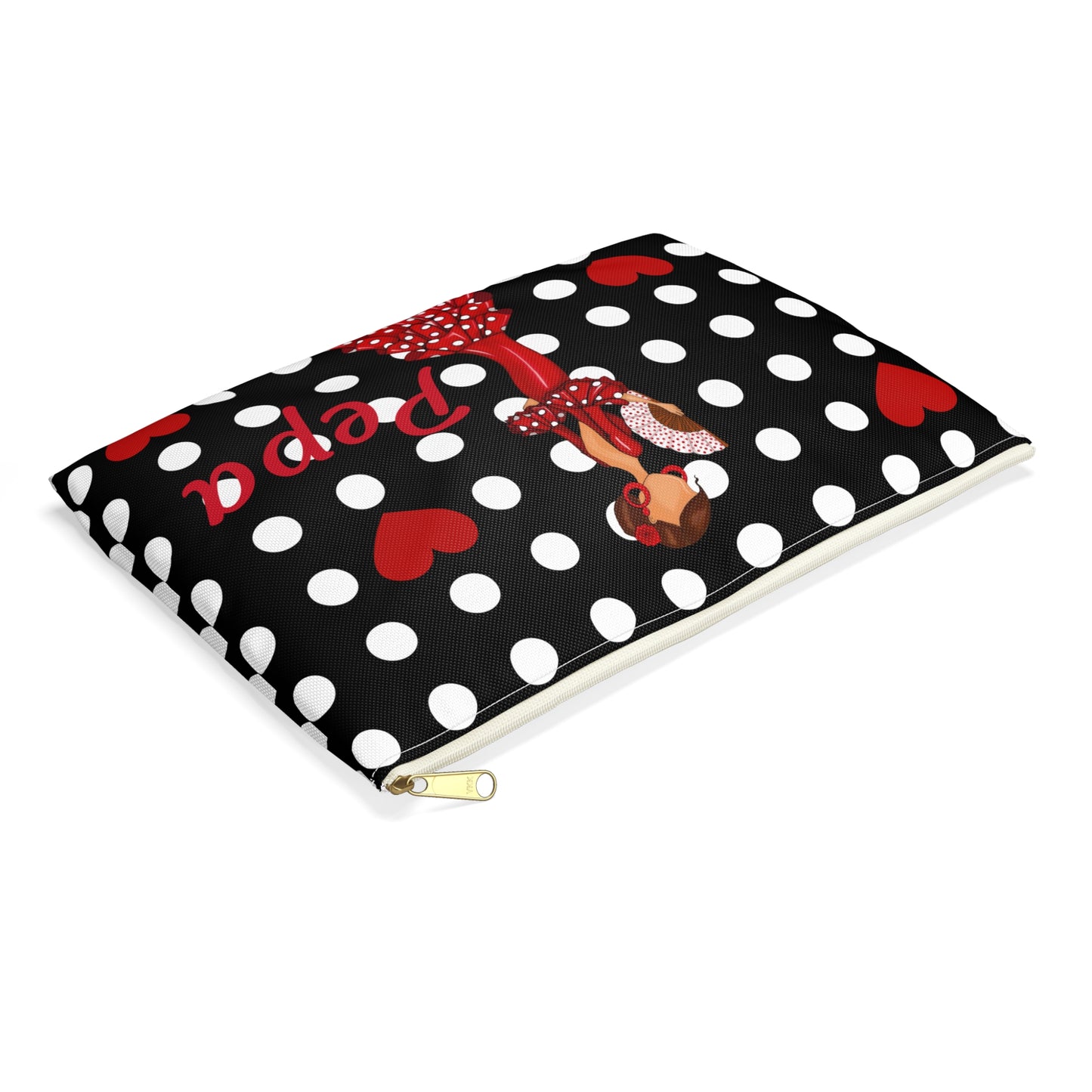 a black and white polka dot notebook with a red bow