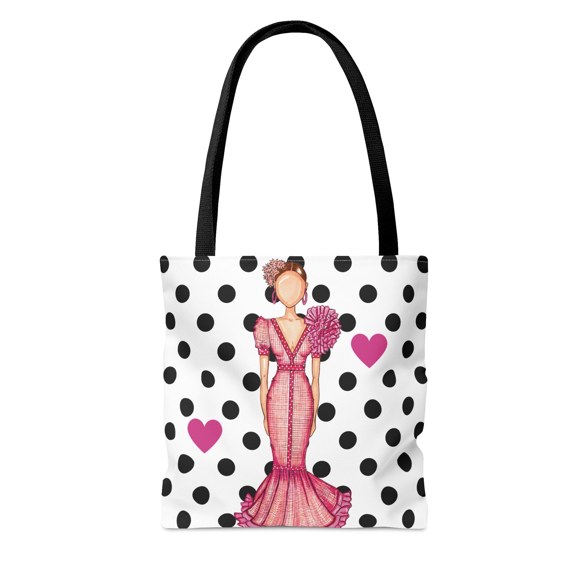 a polka dot bag with a woman in a pink dress