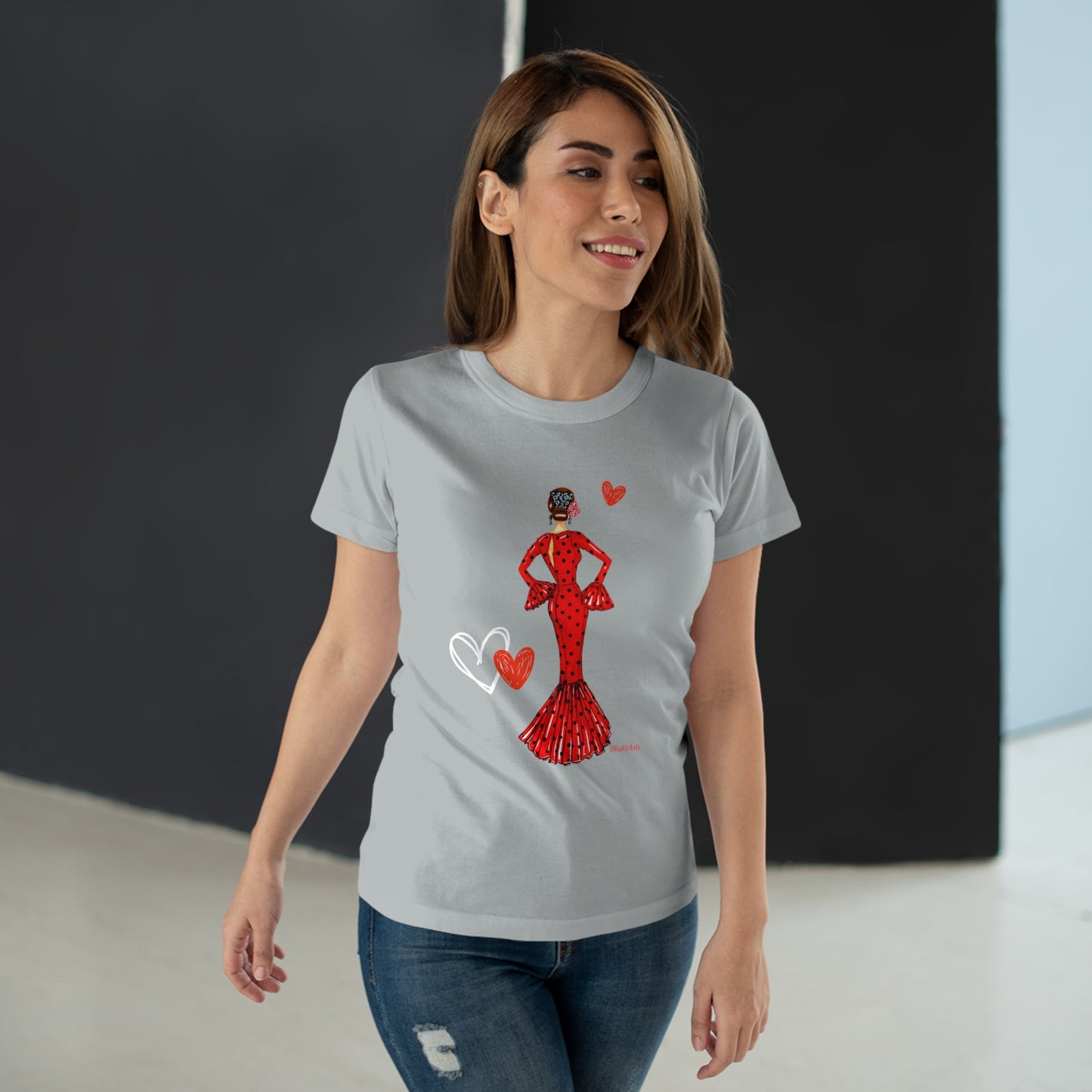 a woman wearing a t - shirt with a red dress and heart on it