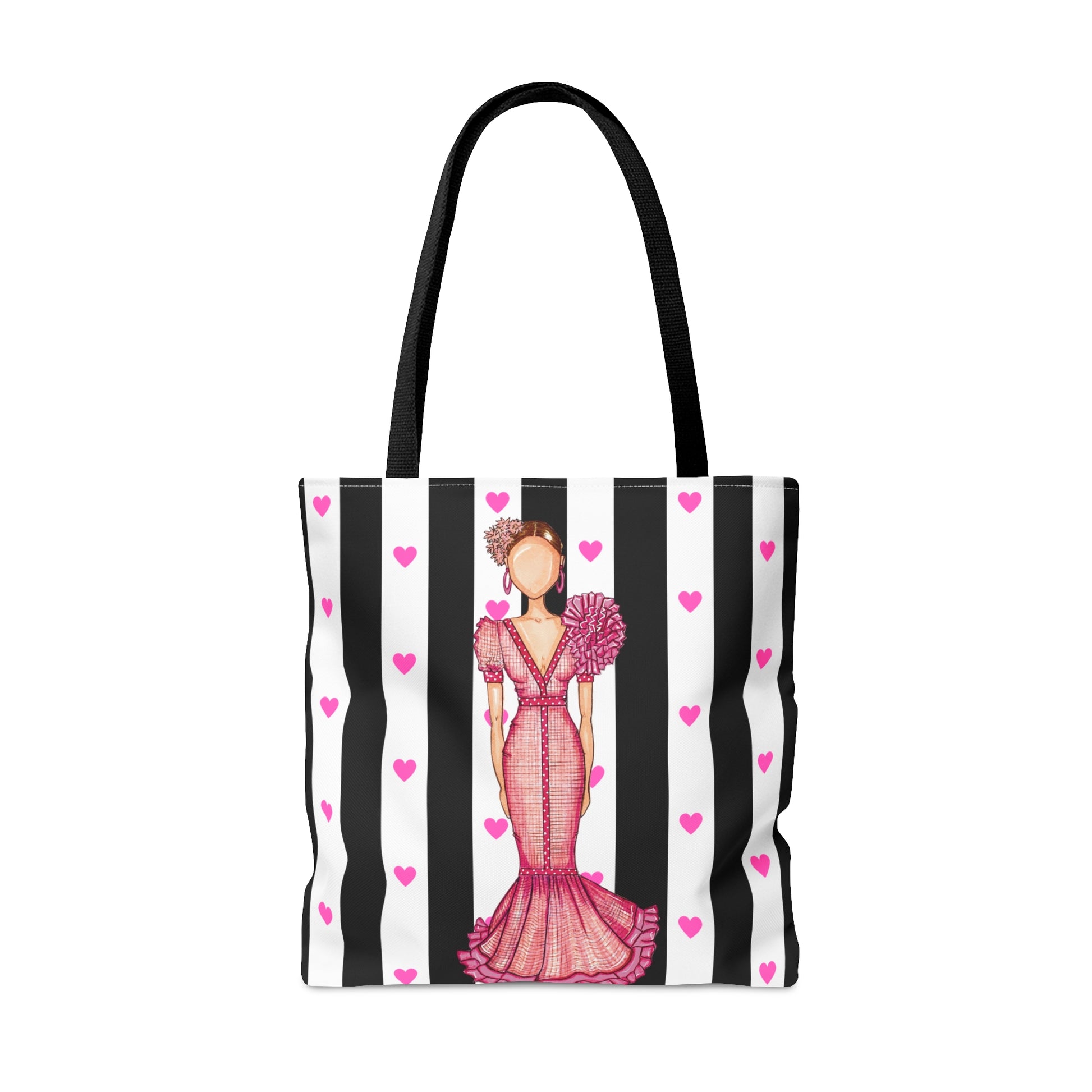 a black and white striped bag with a woman in a pink dress
