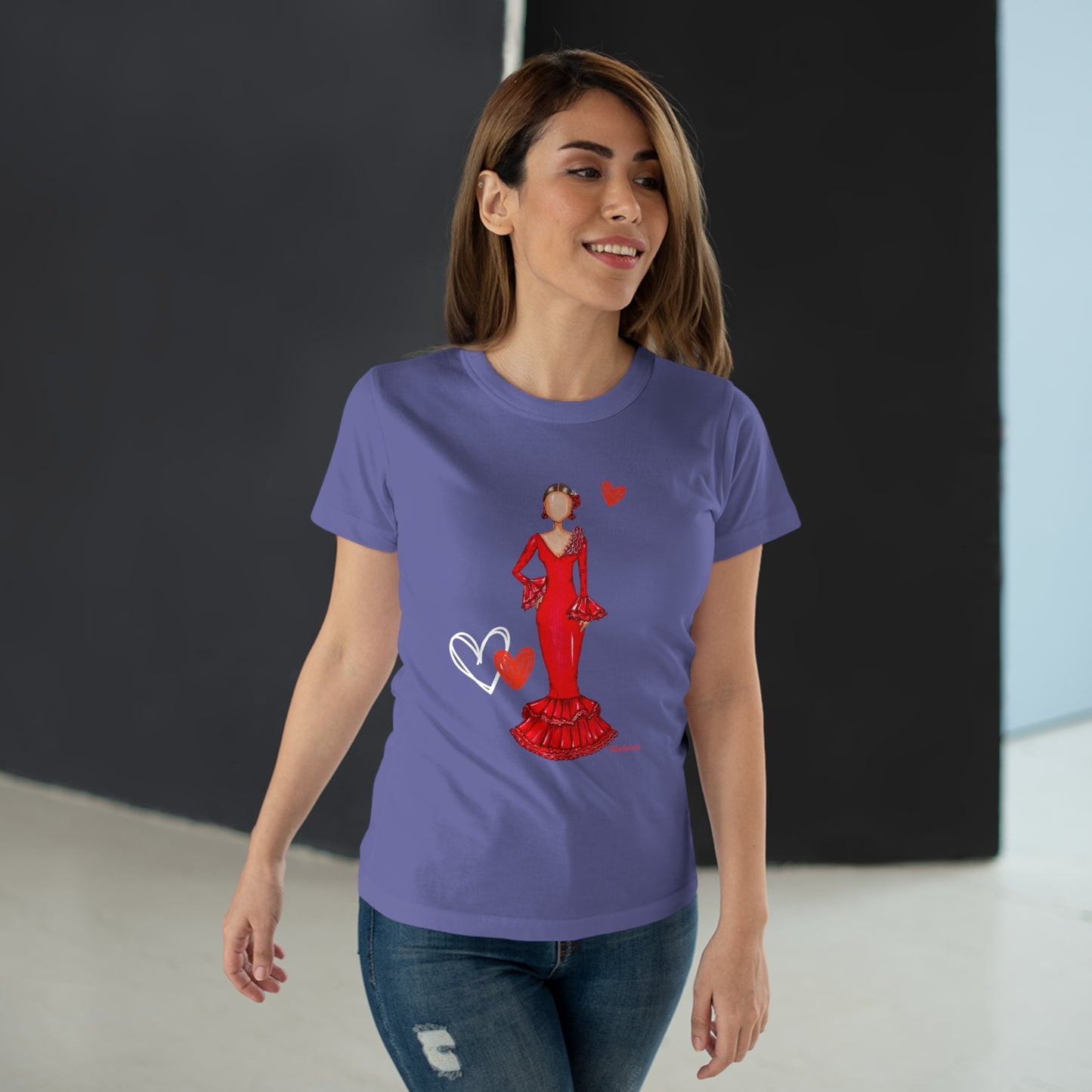 a woman wearing a purple t - shirt with a picture of a woman in a