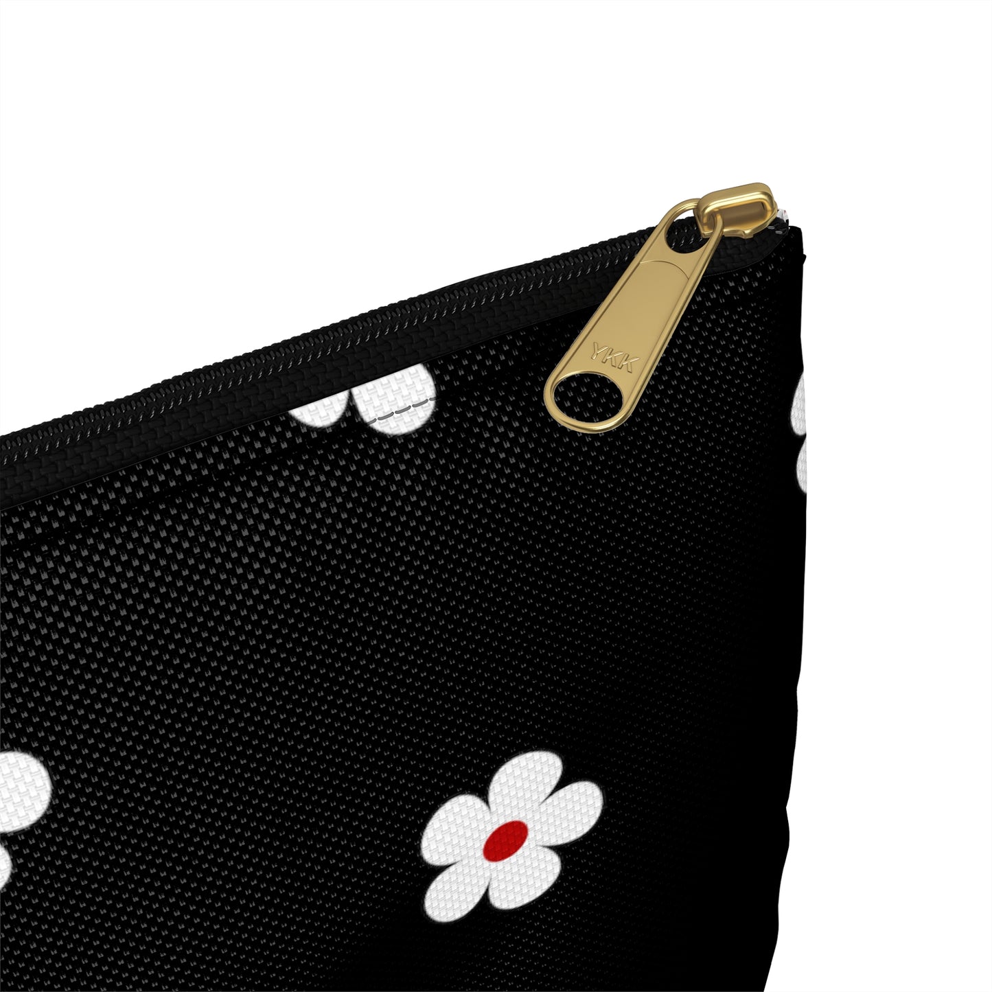 a black purse with white and red flowers on it