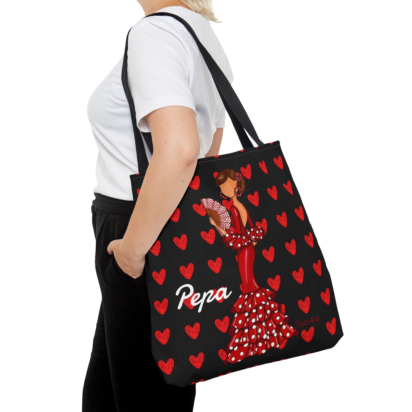a woman carrying a bag with a picture of a woman in a red dress