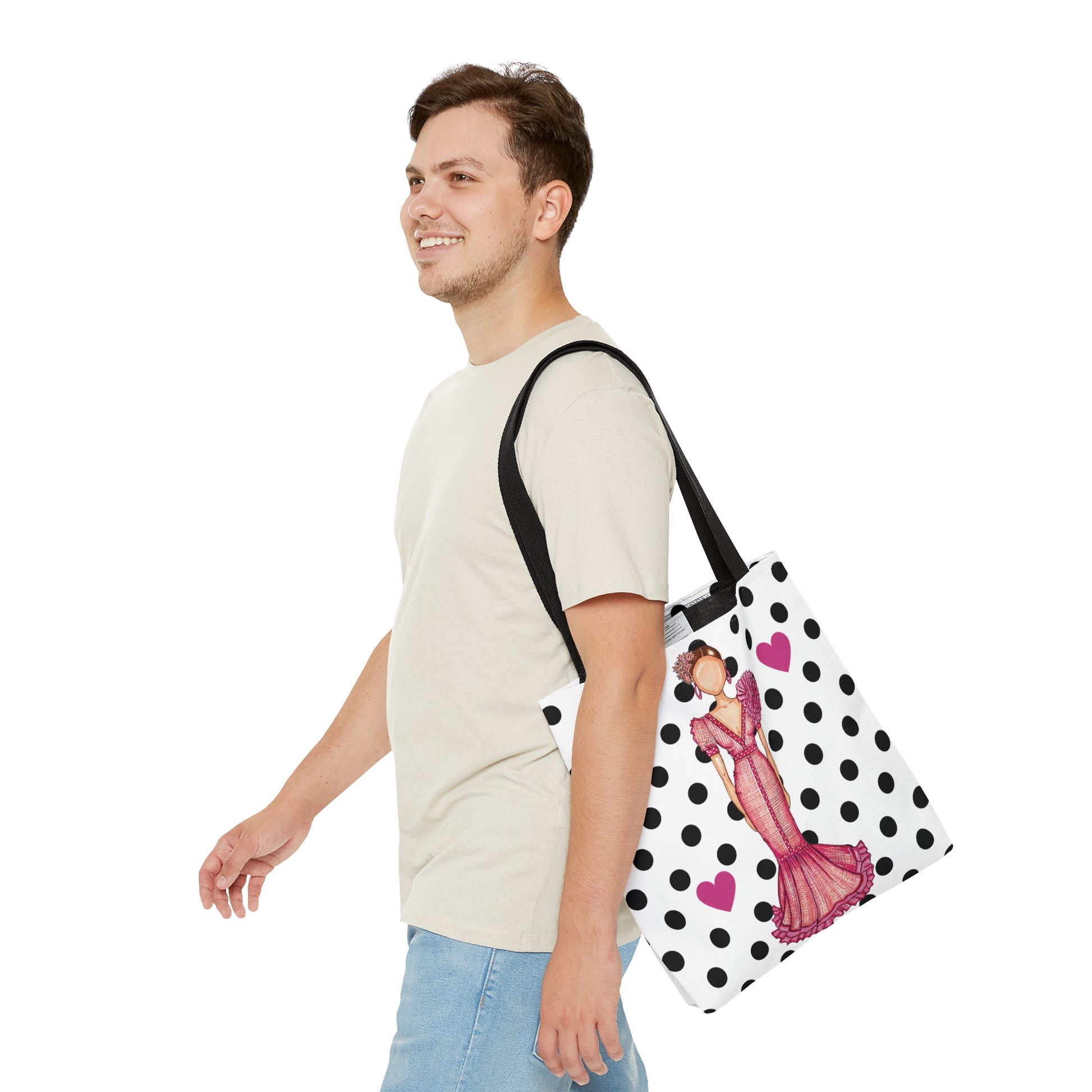 a man walking with a polka dot bag on his shoulder