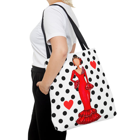 a woman carrying a polka dot bag with a picture of a woman in a red
