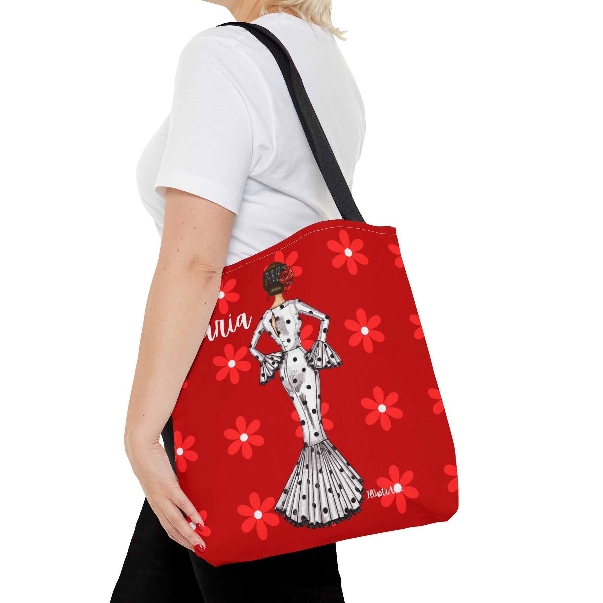 a woman carrying a red tote bag with a dalmatian design