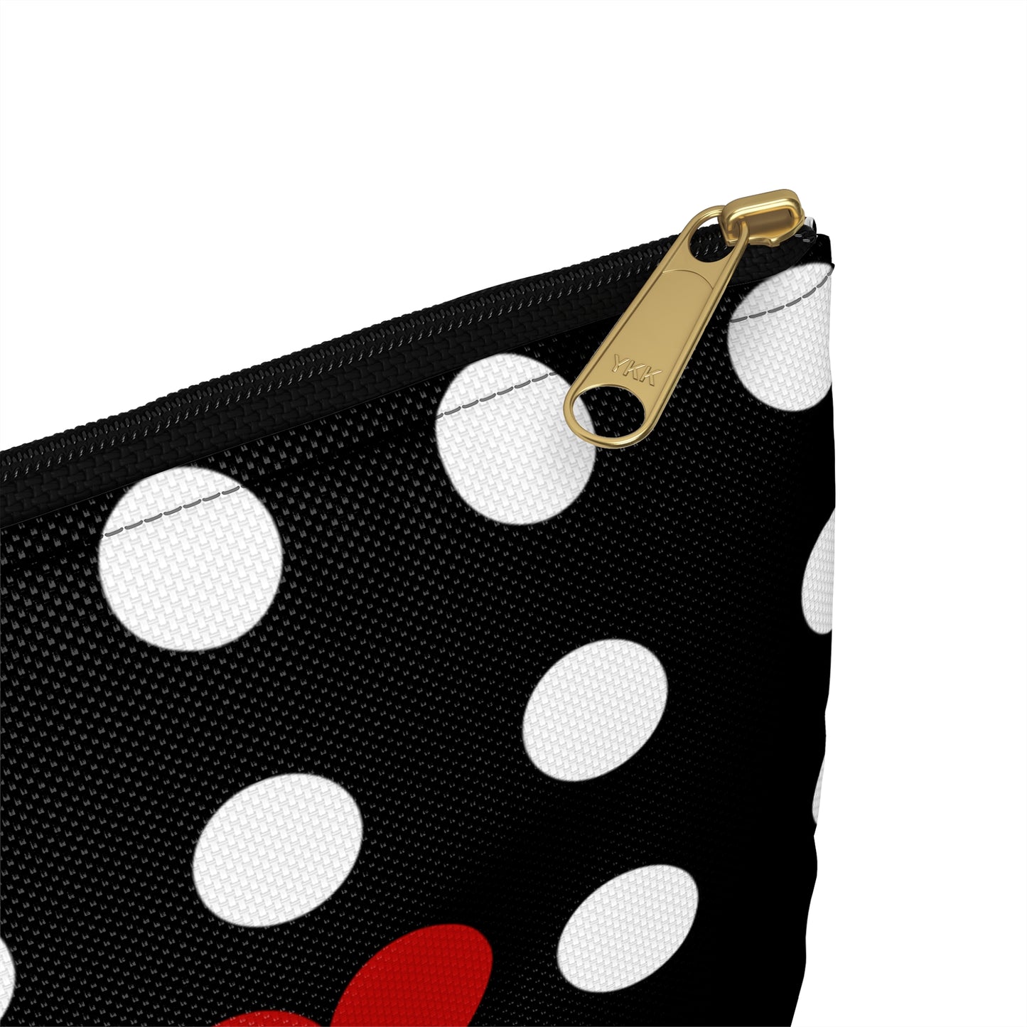 a black and white polka dot purse with red and white polka dots