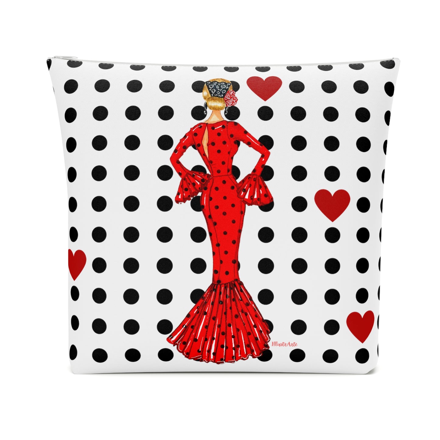 a red and black polka dot pillow with a lady in a red dress