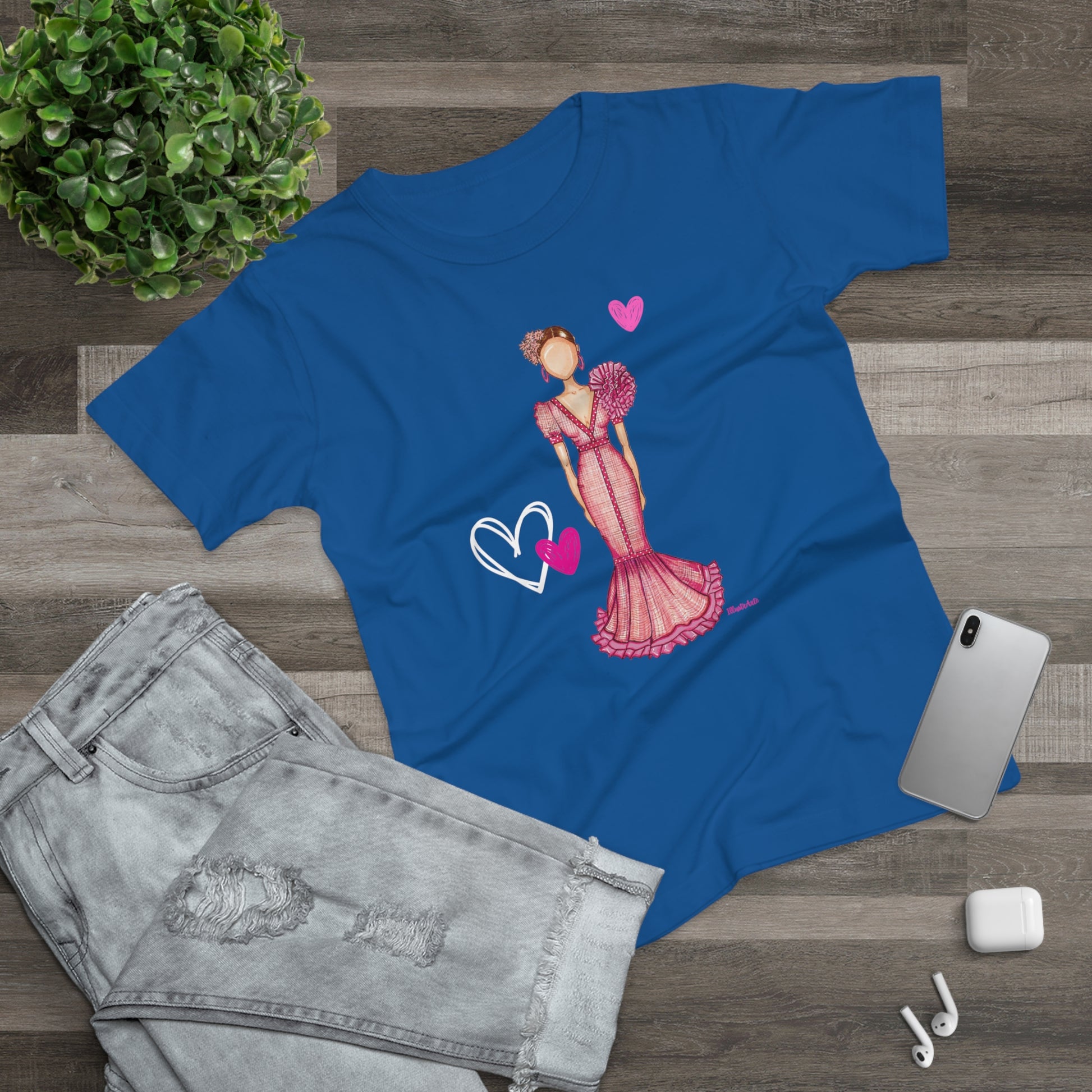 a blue t - shirt with a picture of a woman holding a heart