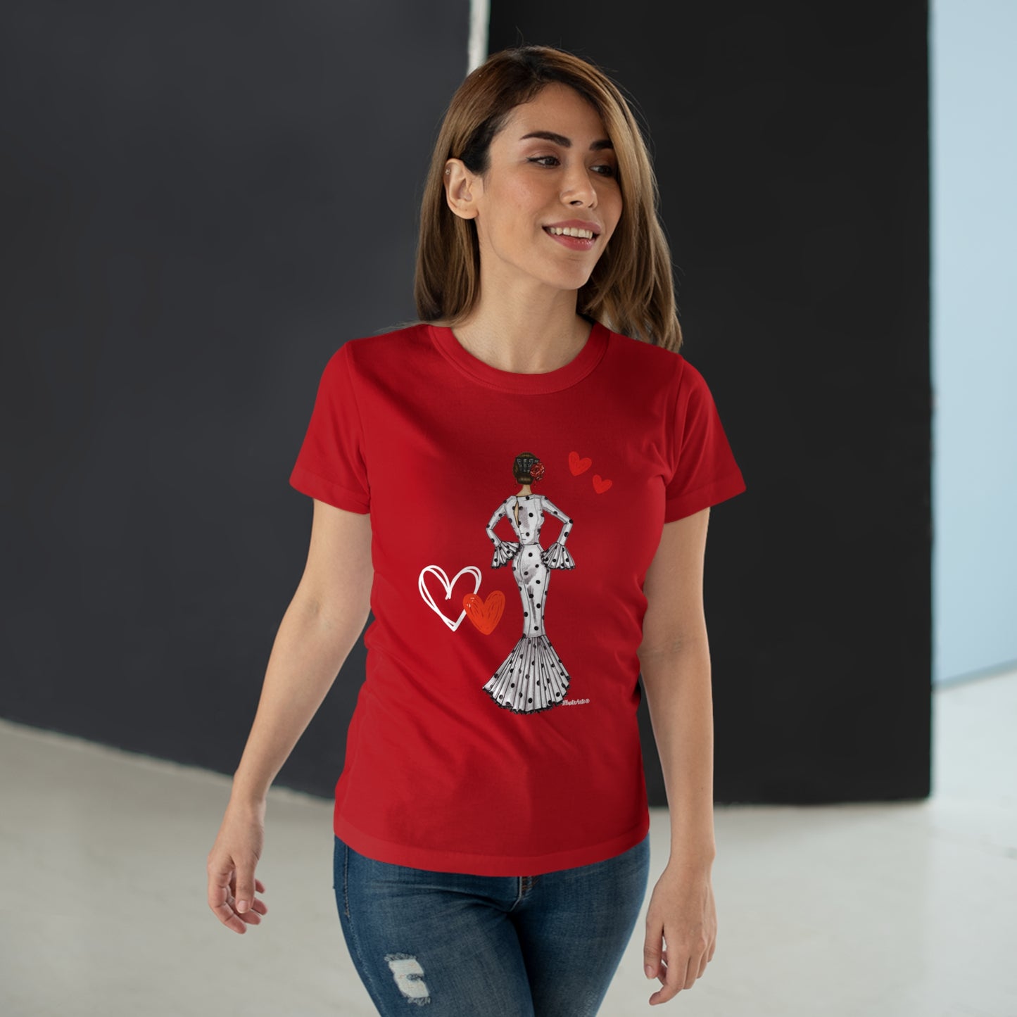 a woman wearing a red t - shirt with a graphic of a woman holding a