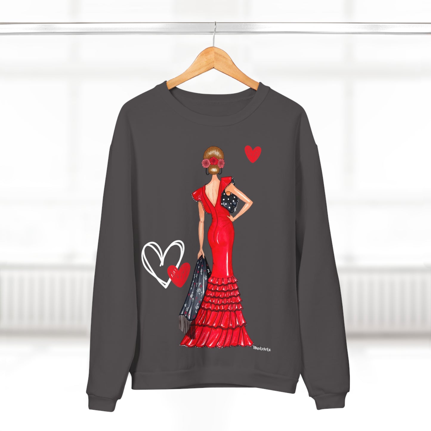a sweater with a woman in a red dress on a hanger
