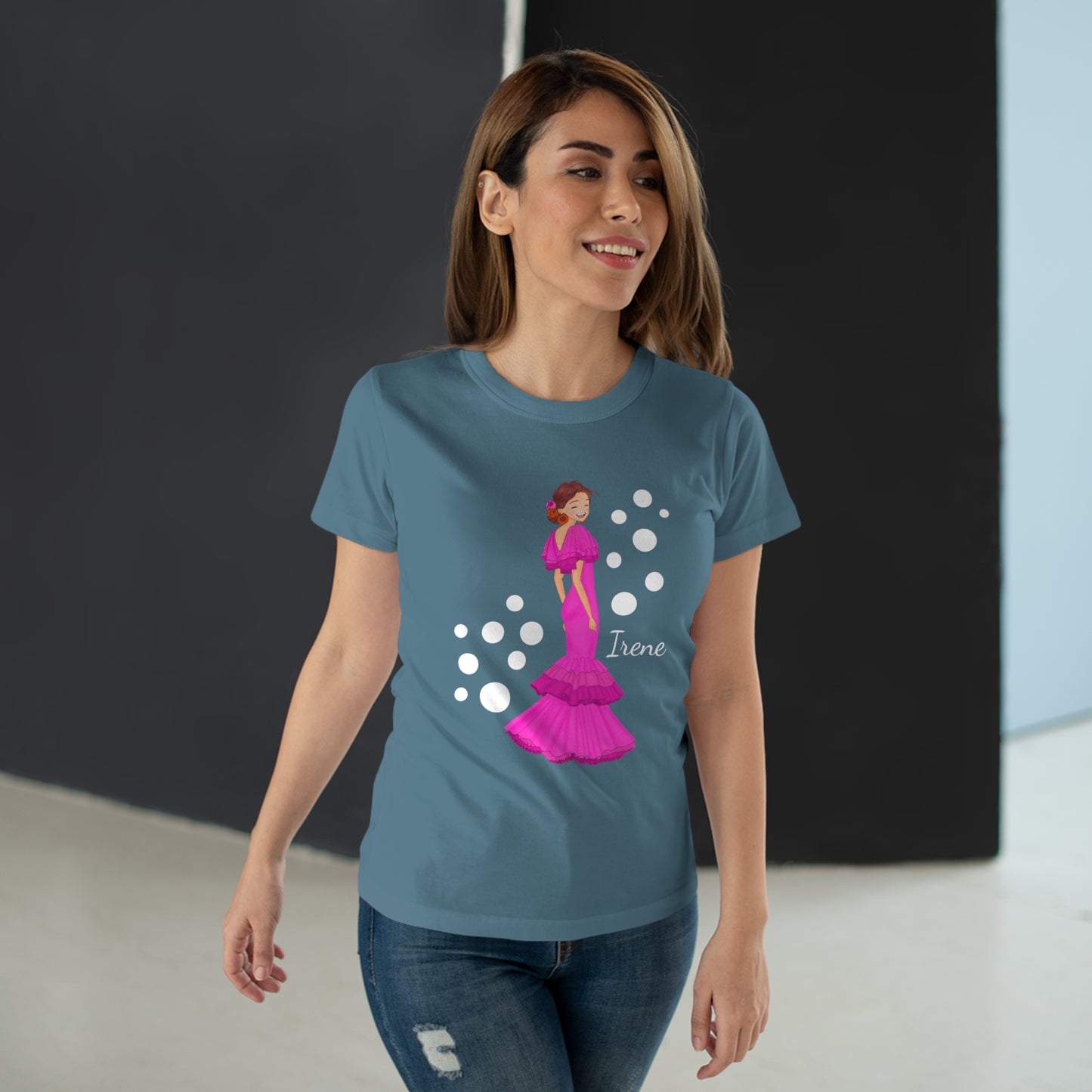 a woman wearing a blue t - shirt with a pink princess on it