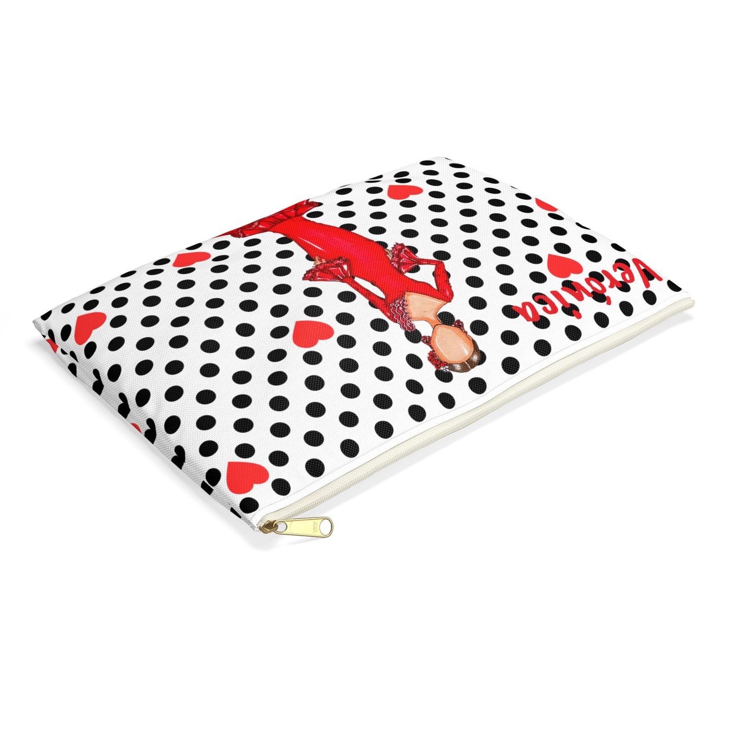 a black and white dotted notebook with a red lady on it