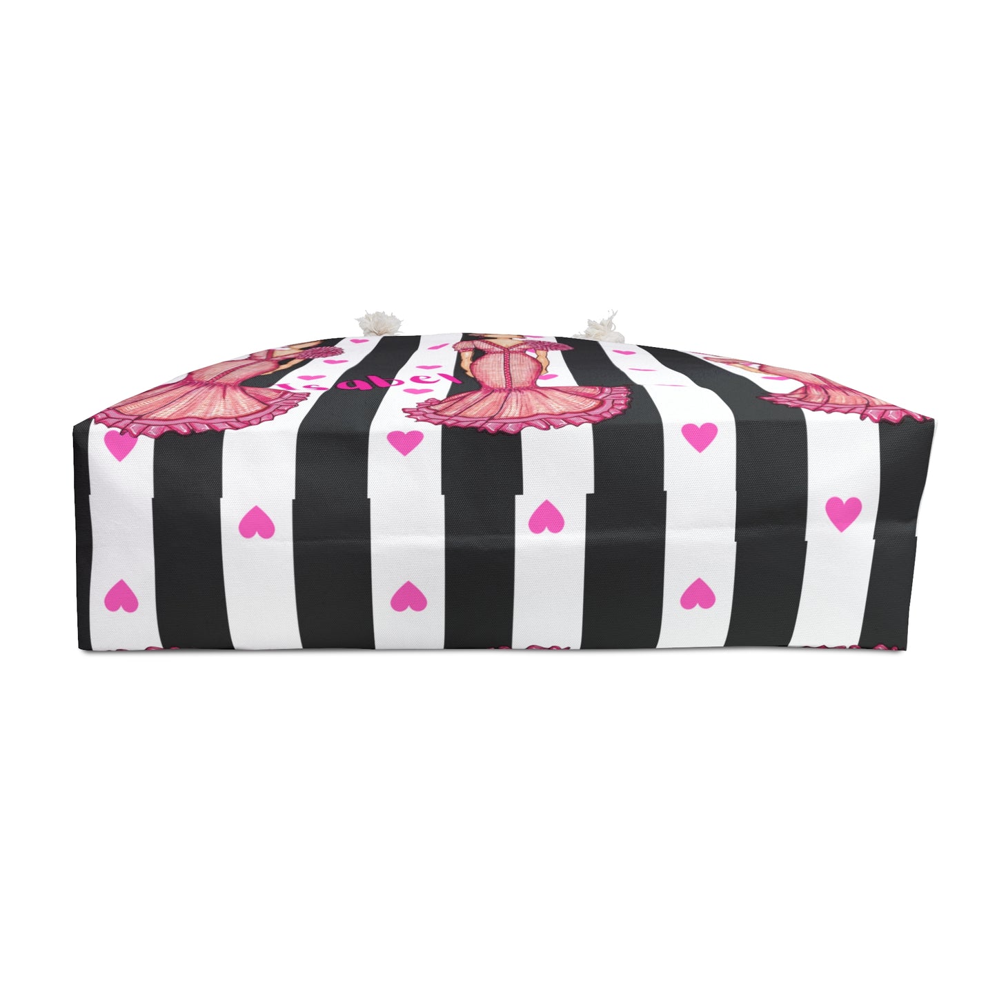 a black and white striped bag with pink butterflies on it