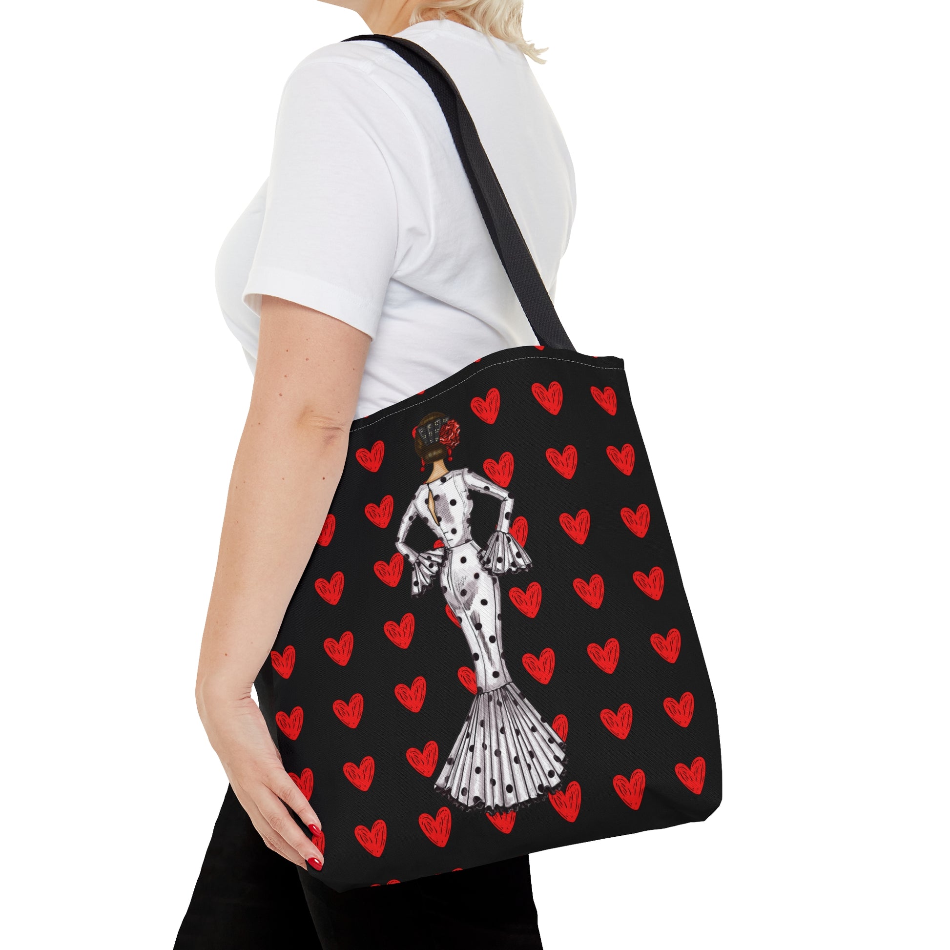 a woman carrying a dalmatian bag with hearts on it