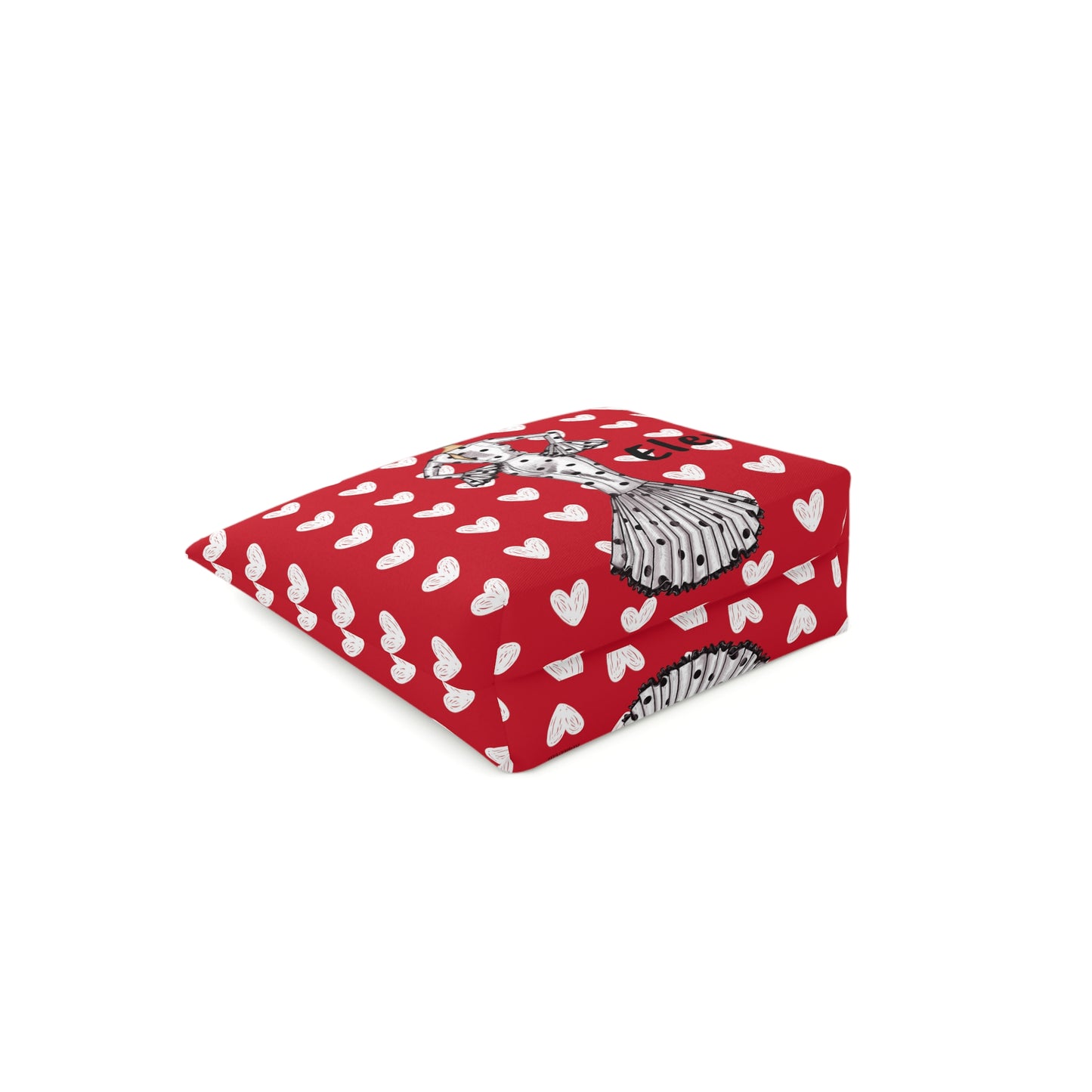 a red blanket with white hearts on it