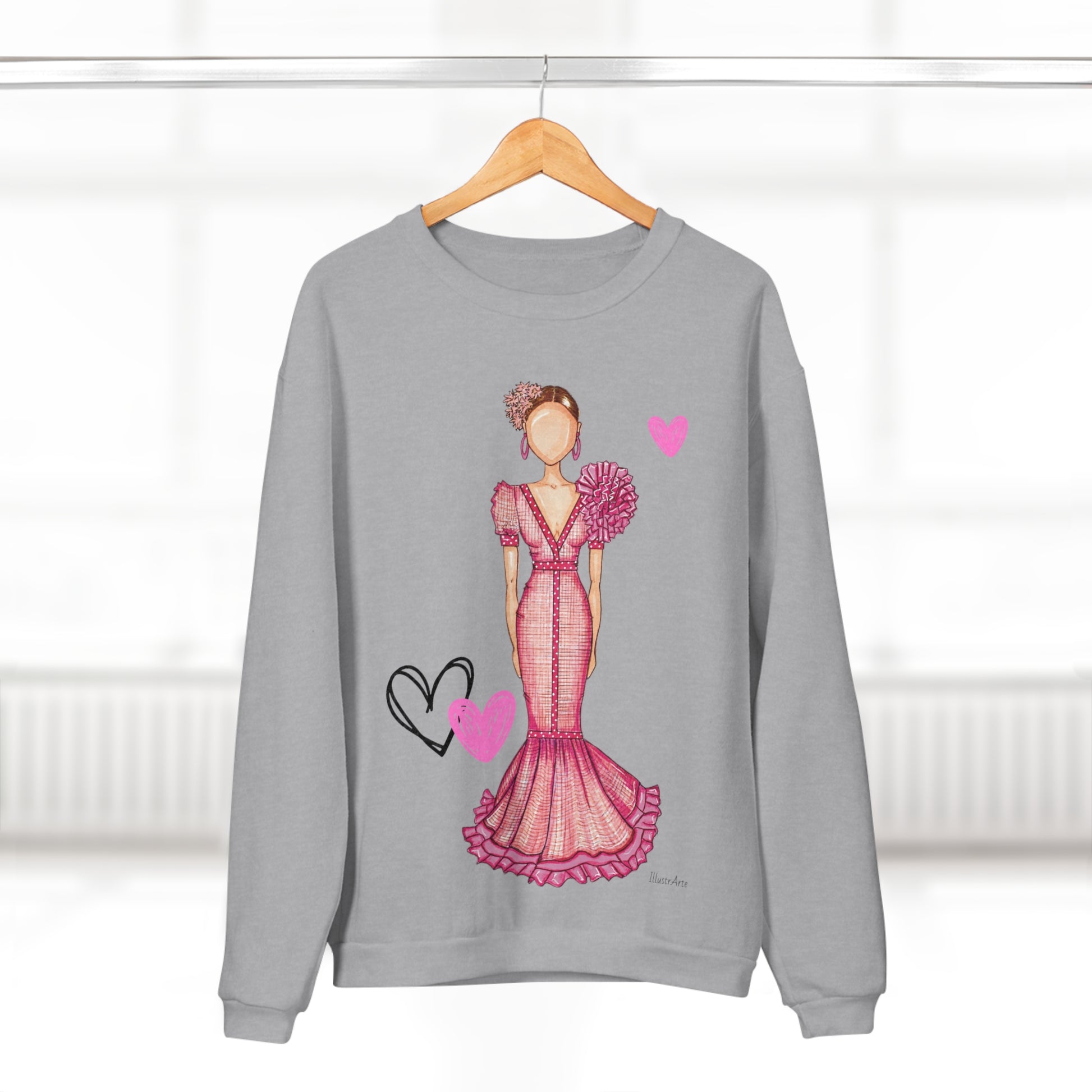 a sweater with a drawing of a woman in a pink dress