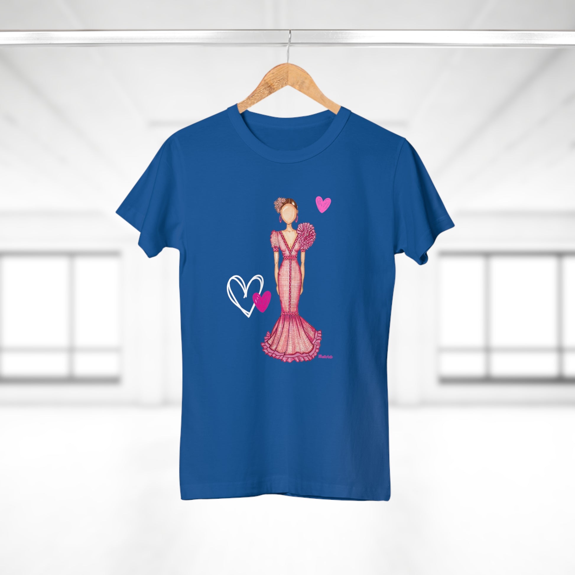 a blue t - shirt with a picture of a woman in a pink dress