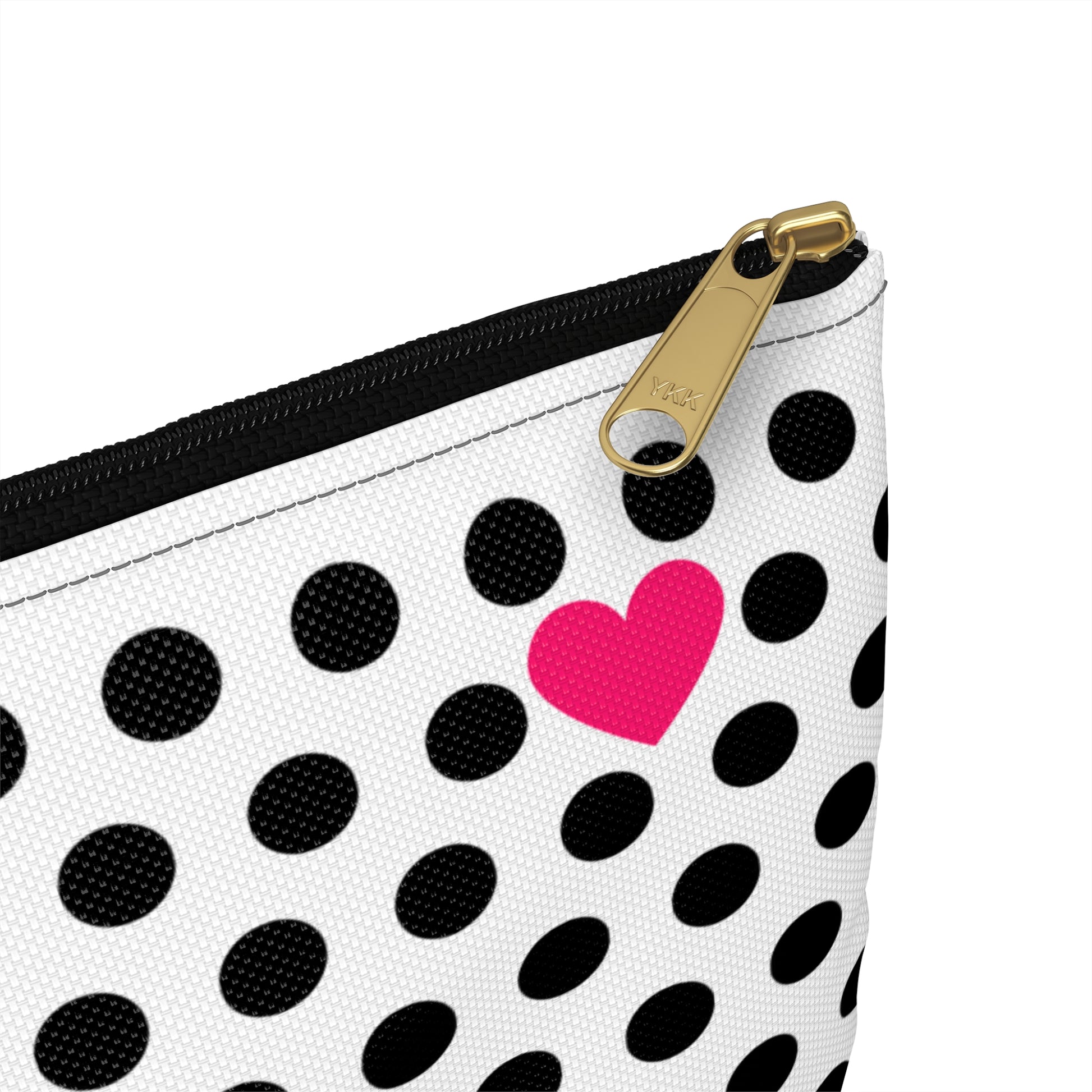 a black and white polka dot purse with a pink heart on it