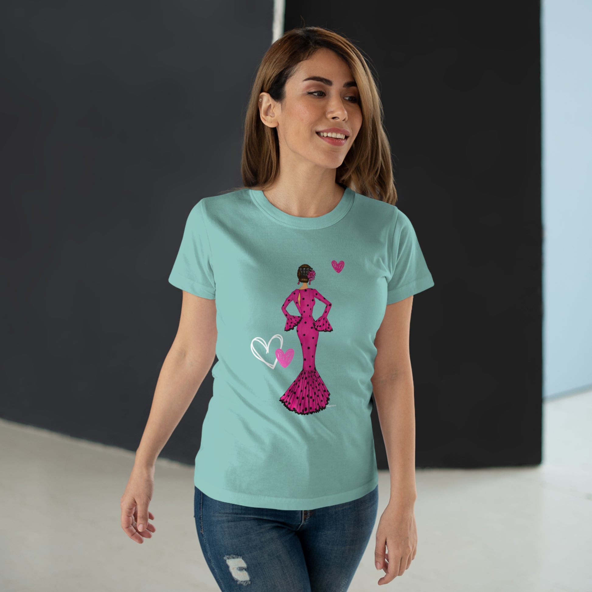 a woman wearing a t - shirt with a pink dress on it