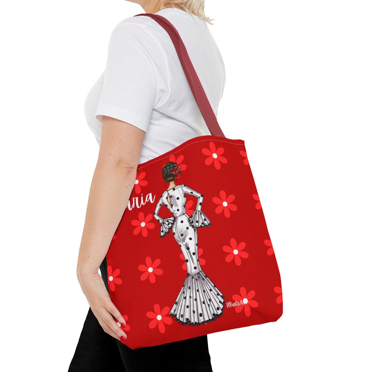 a woman carrying a red tote bag with a dalmatian design
