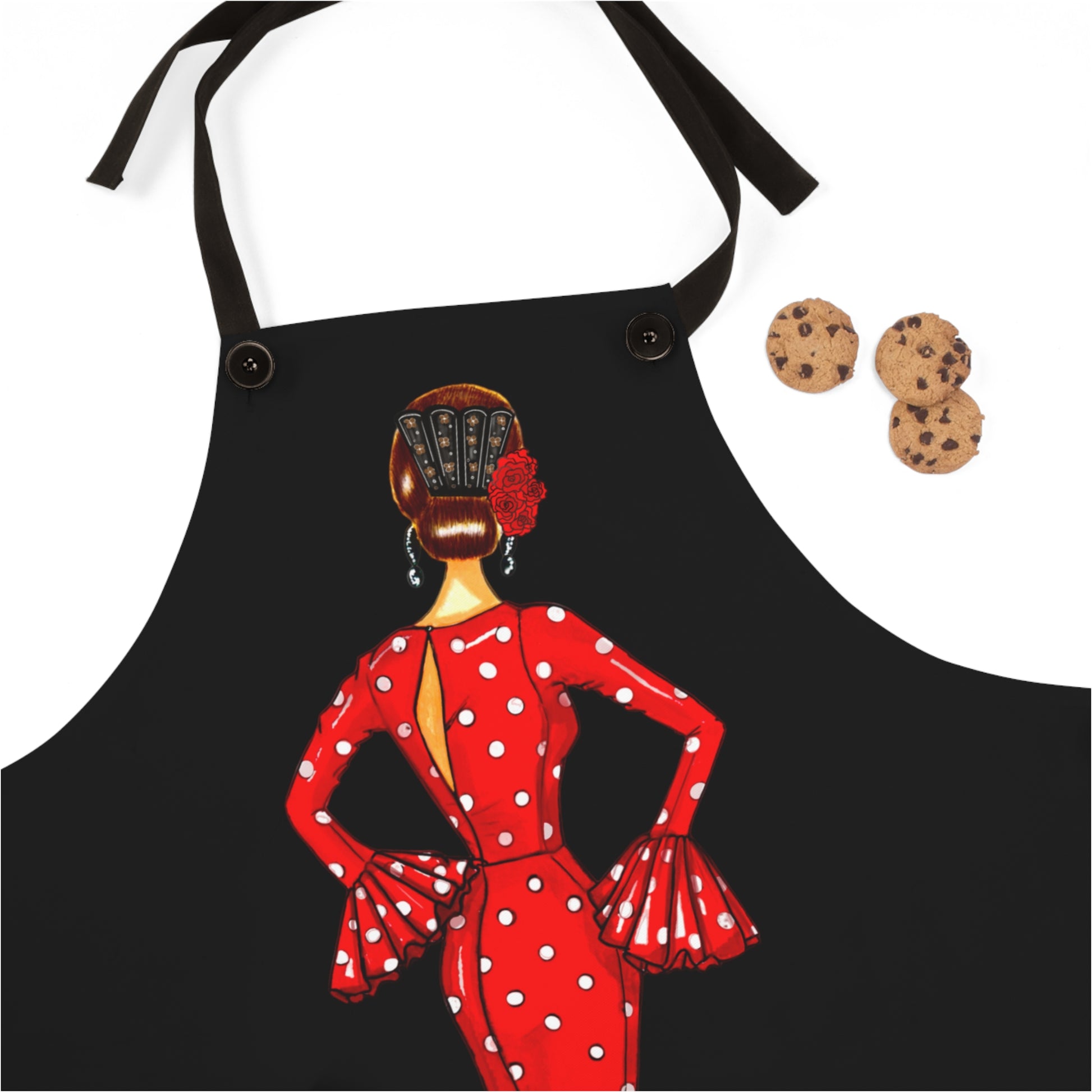 a woman wearing a red polka dot dress and a cookie