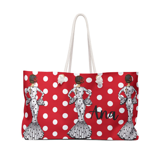 a red and white polka dot bag with a lady on it