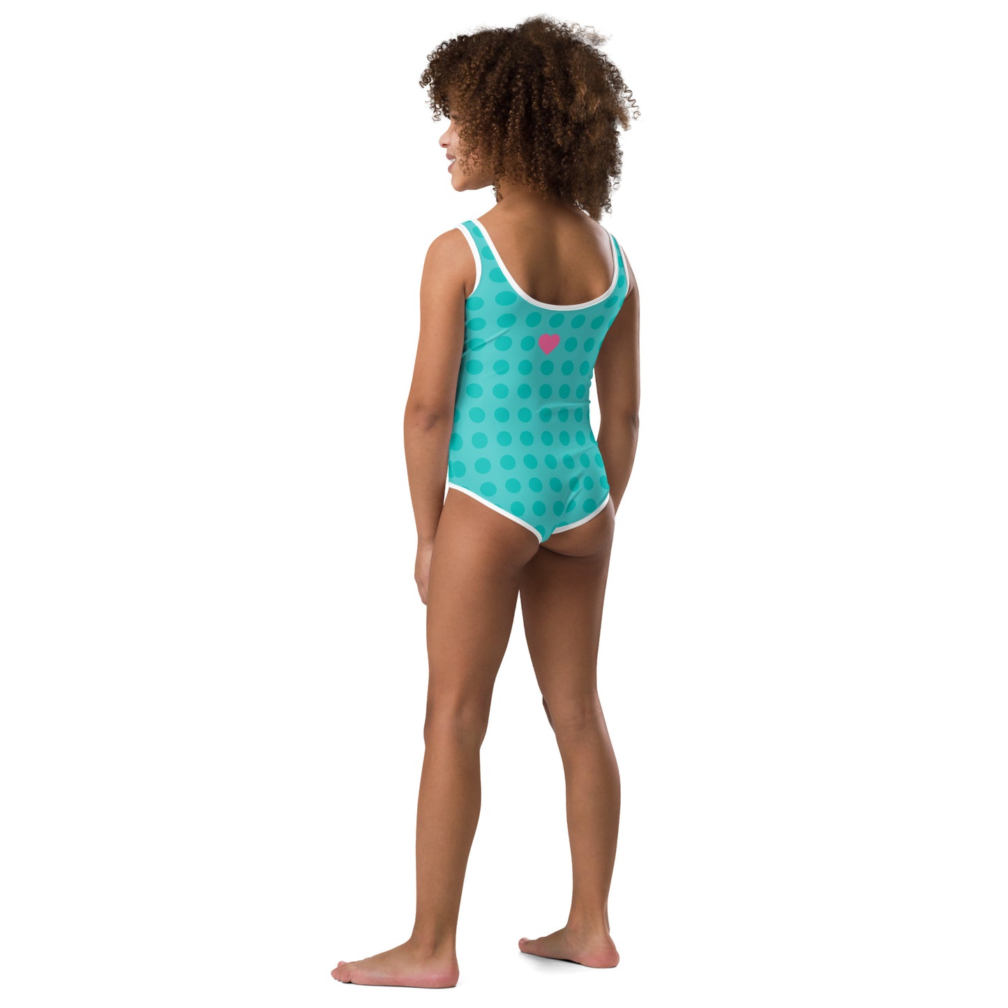 a little girl in a blue and green swimsuit