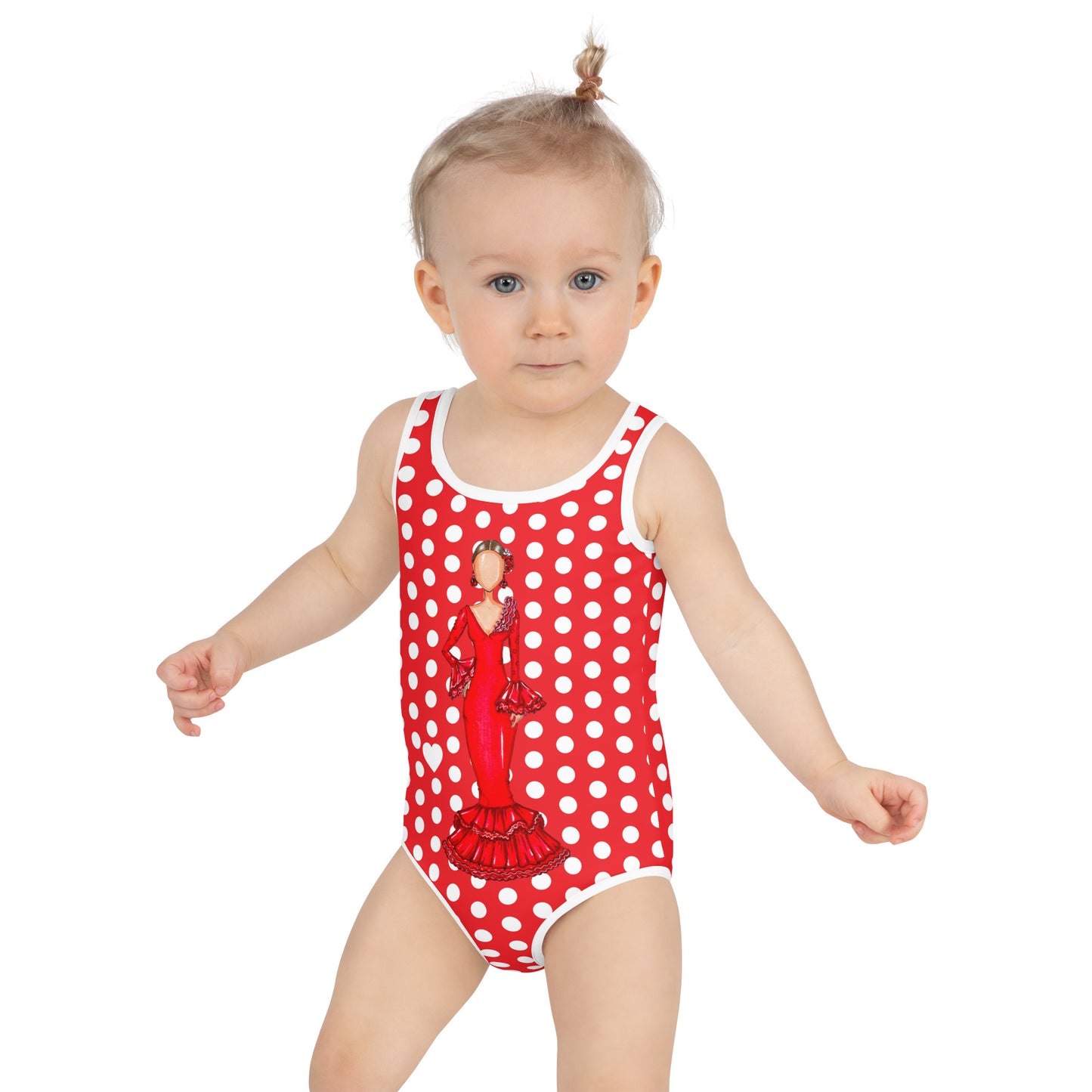 a baby girl wearing a red and white polka dot swimsuit