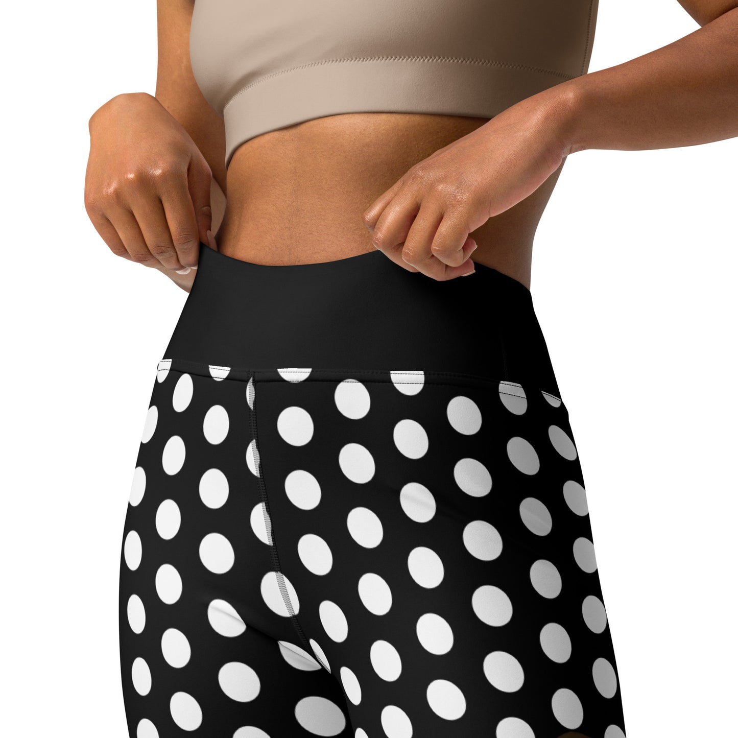a woman in black and white polka dot shorts