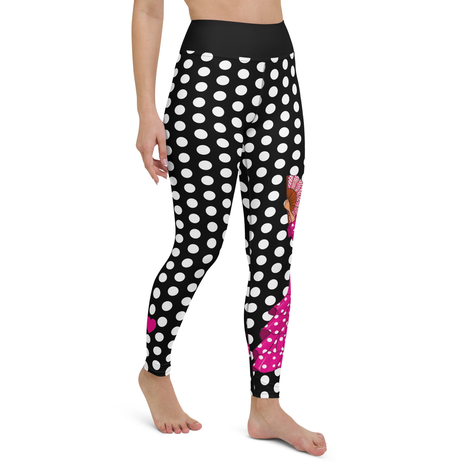 a woman in black and white polka dot print leggings