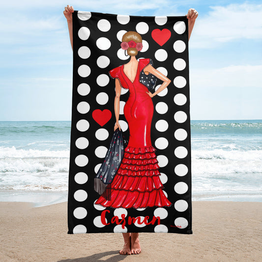 a woman in a red dress holding a black and white polka dot towel