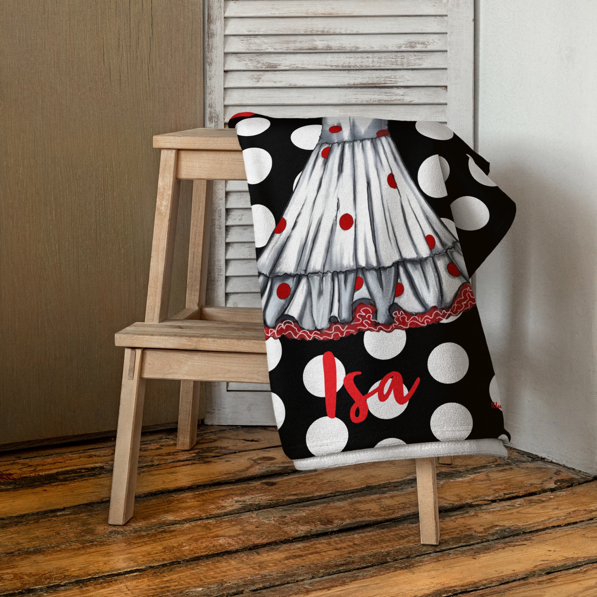 a black and white polka dot chair with a red and white umbrella
