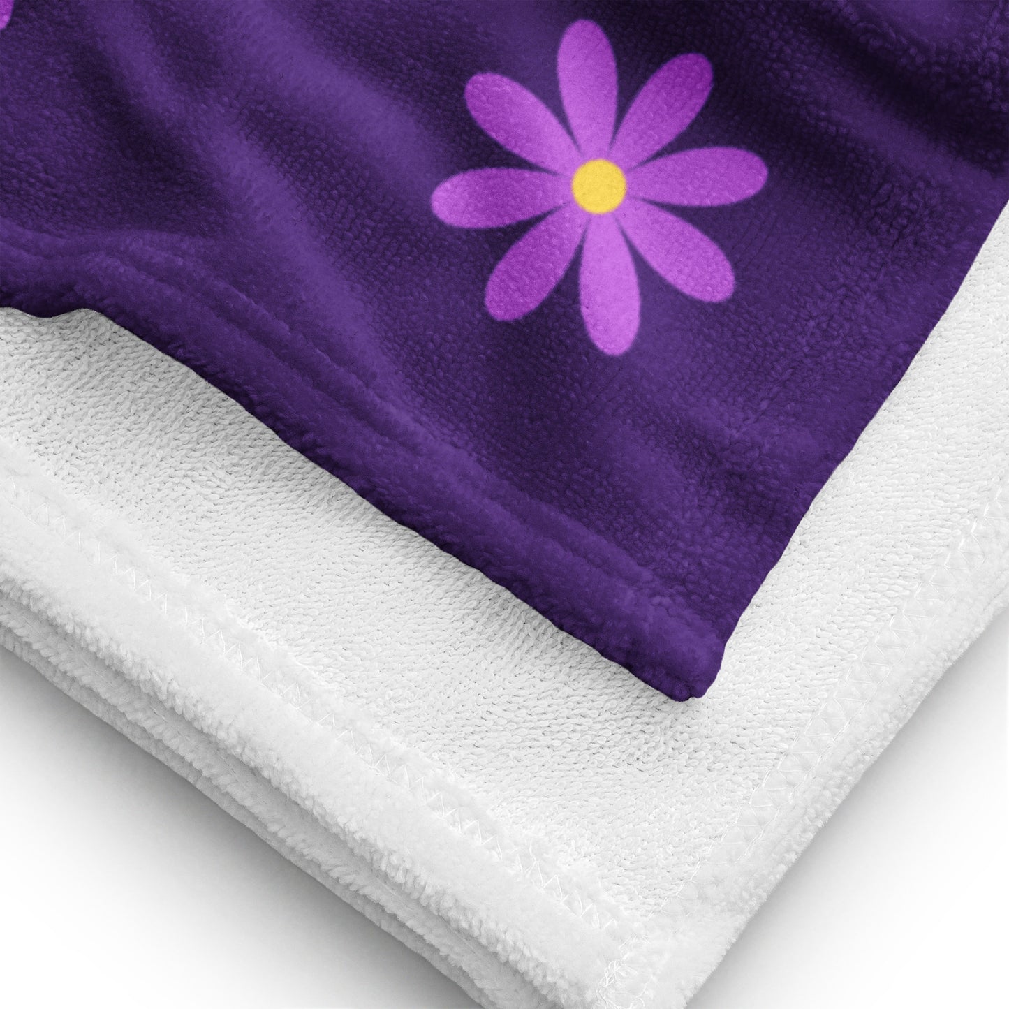 a towel with a purple flower on it