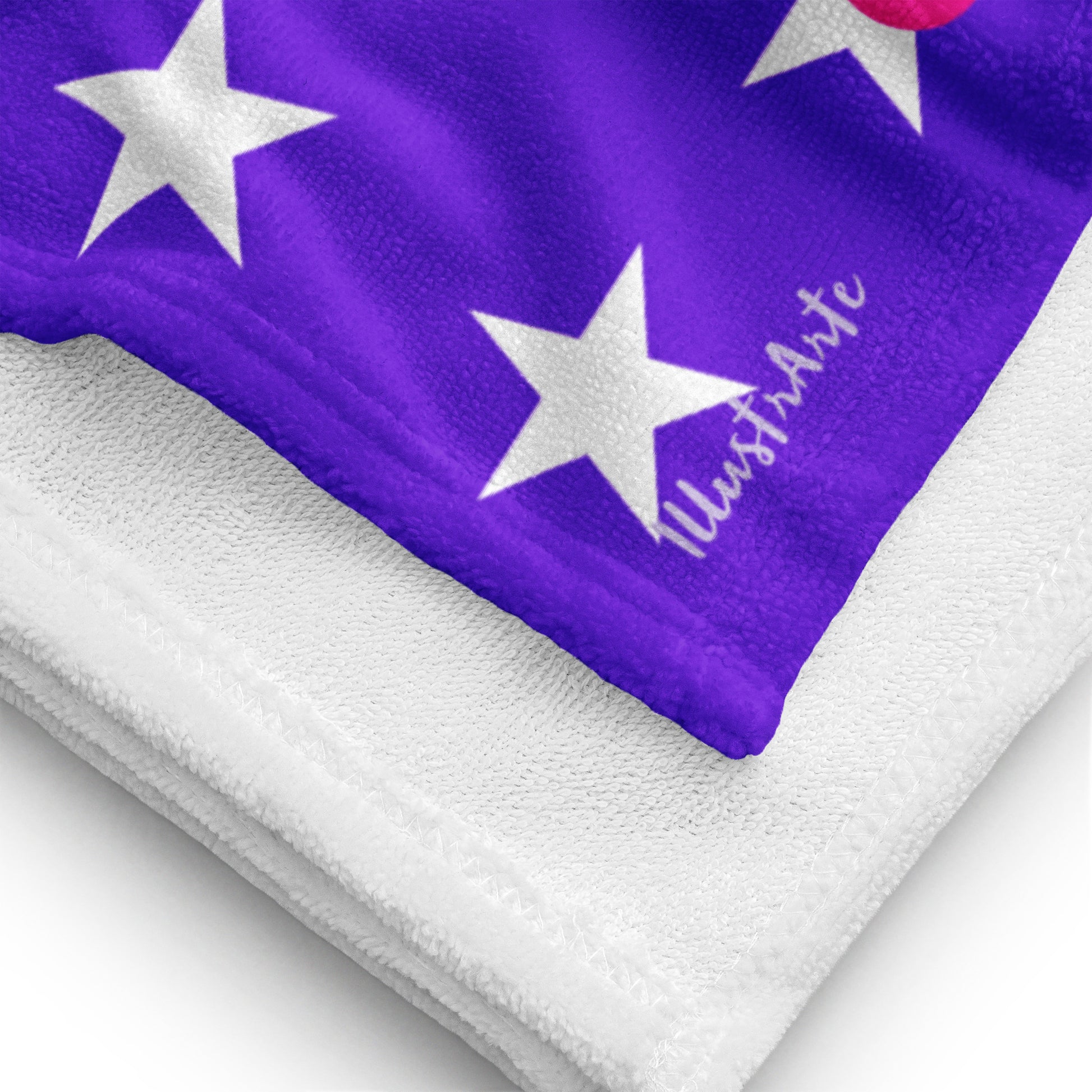 a purple and white towel with white stars on it