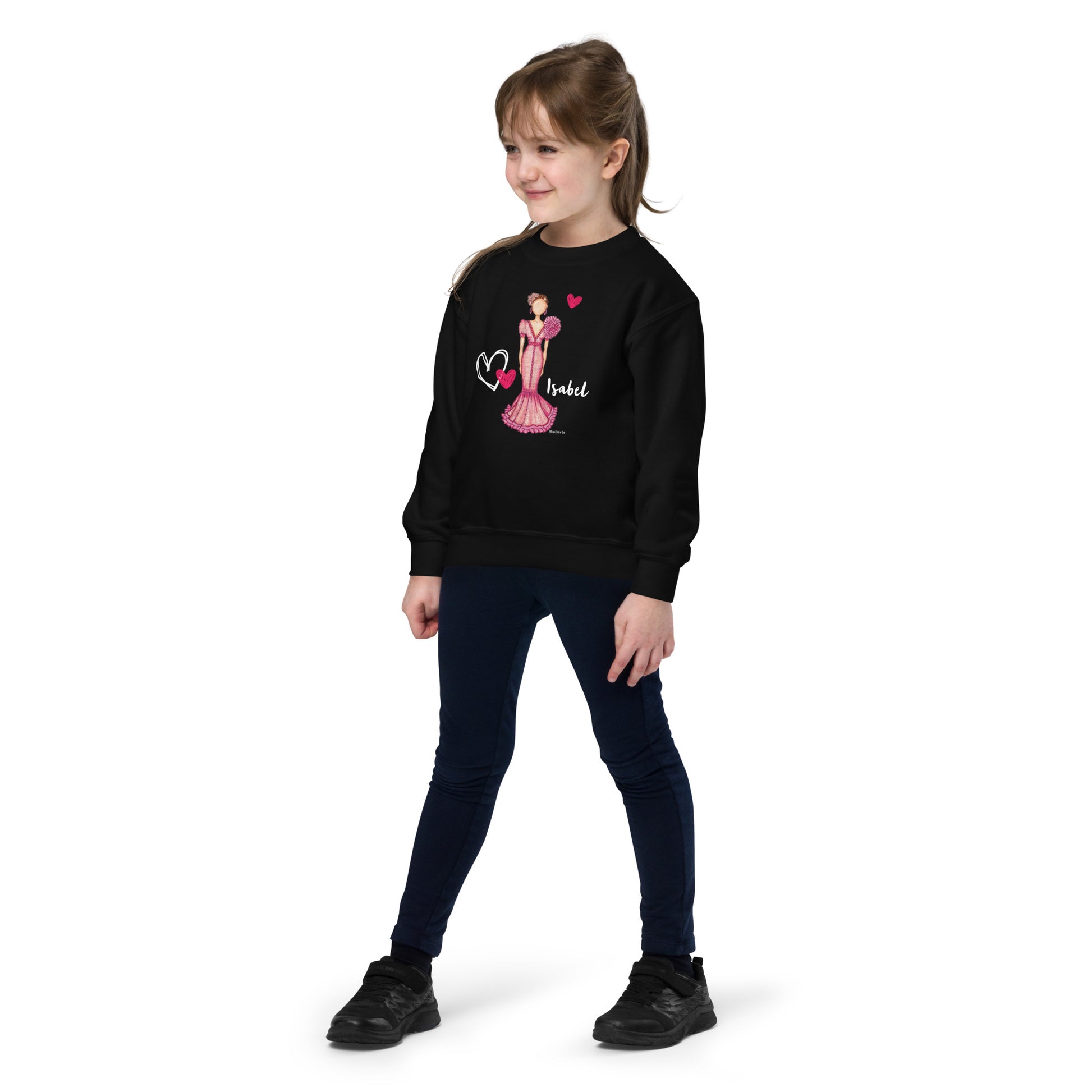 a young girl wearing a black sweatshirt and jeans