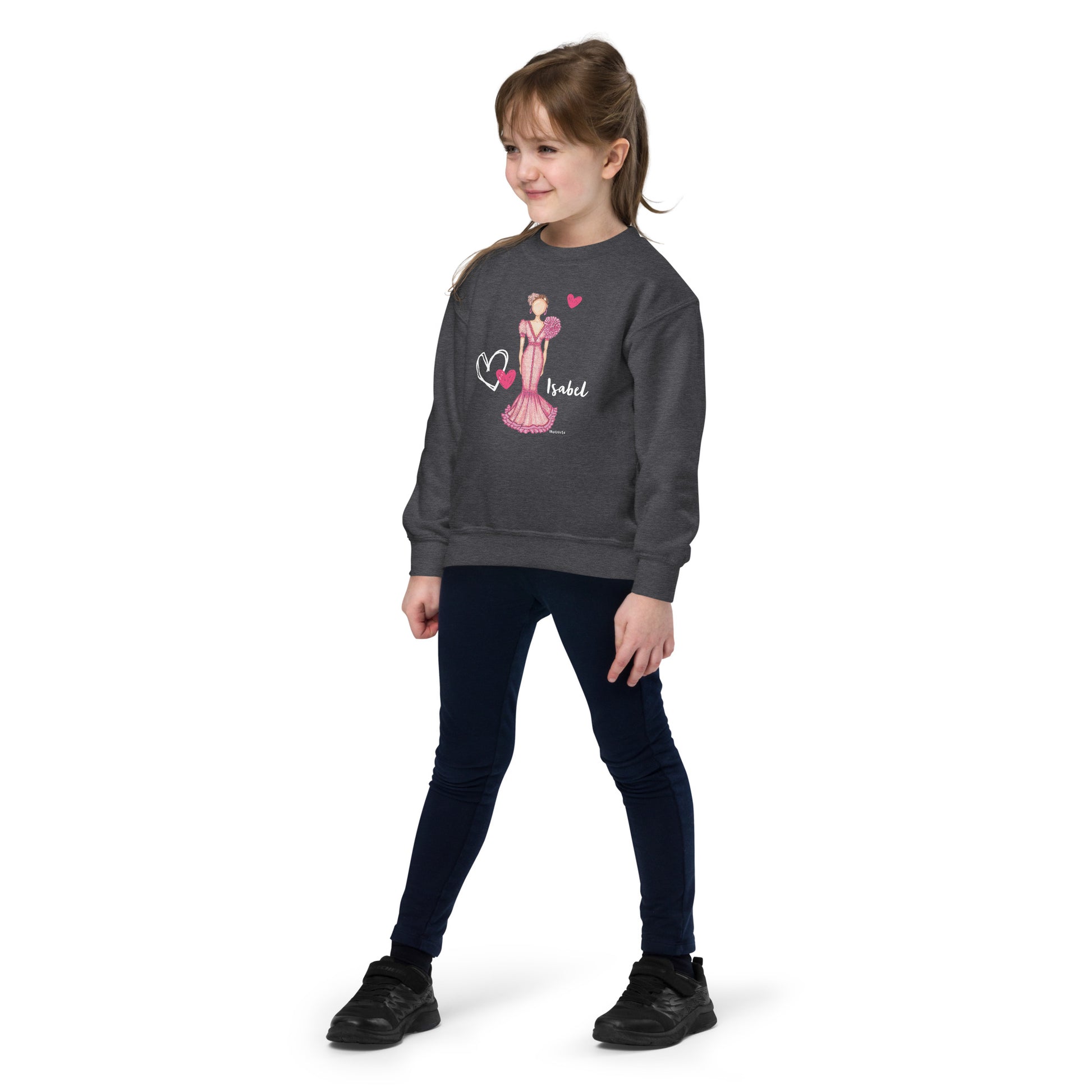 a little girl wearing a sweatshirt and leggings