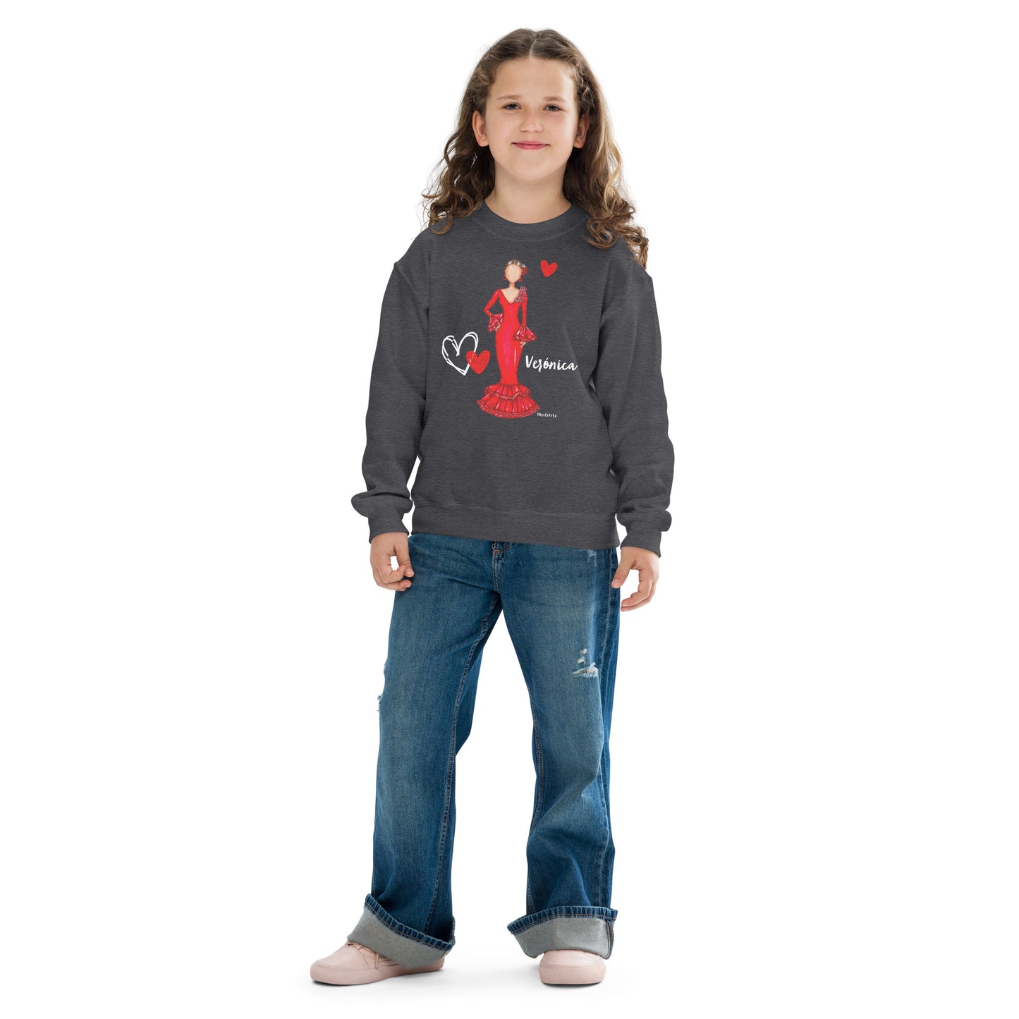 a little girl wearing a mickey mouse sweatshirt