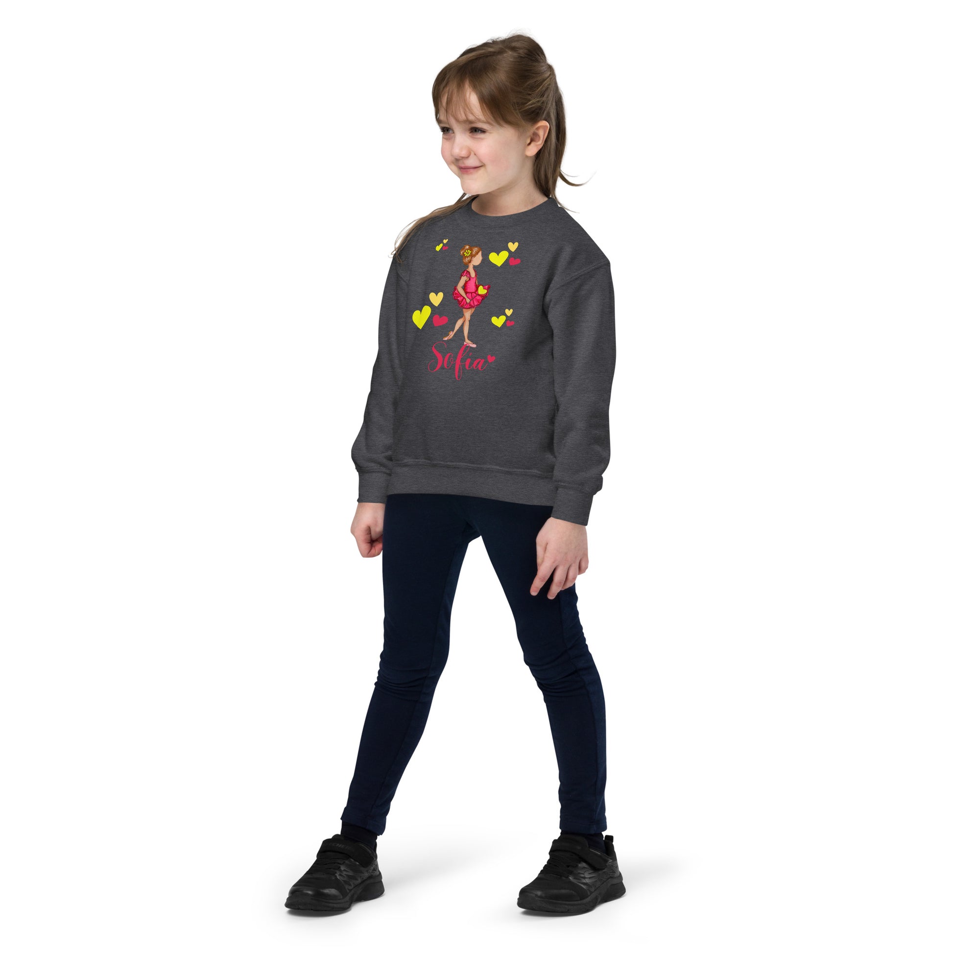 a young girl wearing a sweatshirt with a cartoon character on it