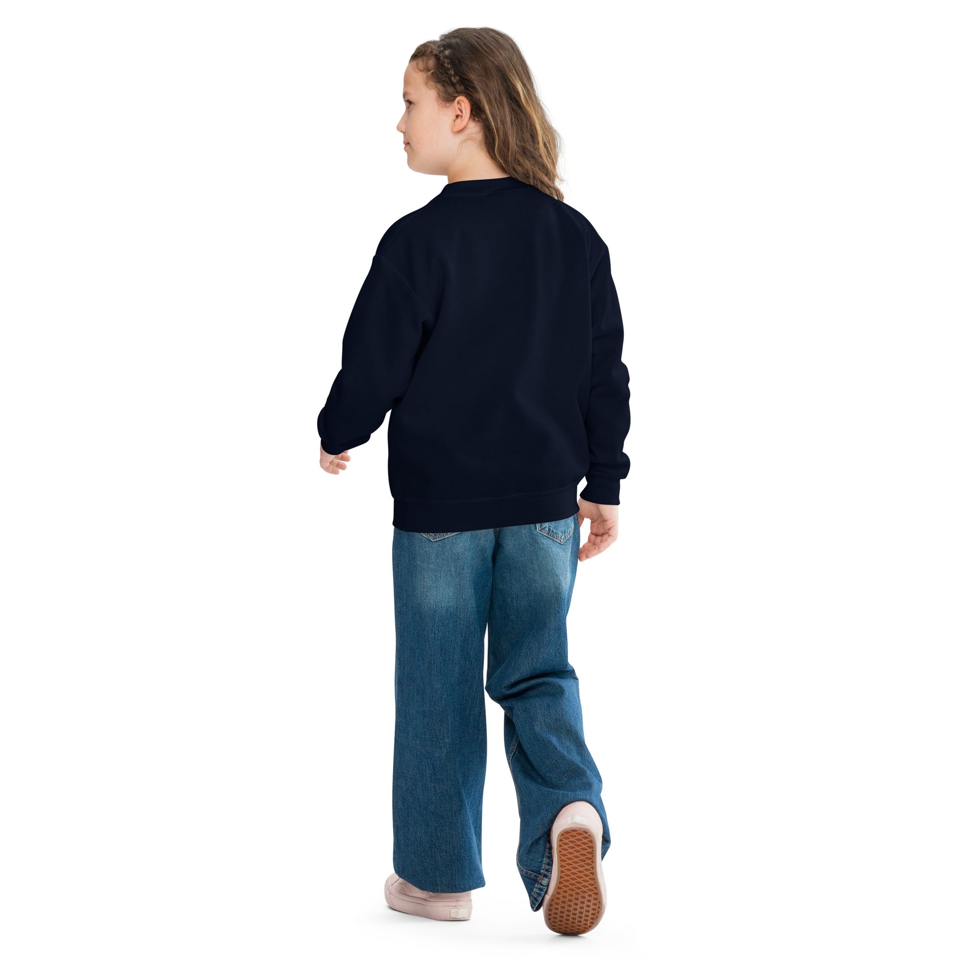 a little girl wearing a black sweatshirt and jeans