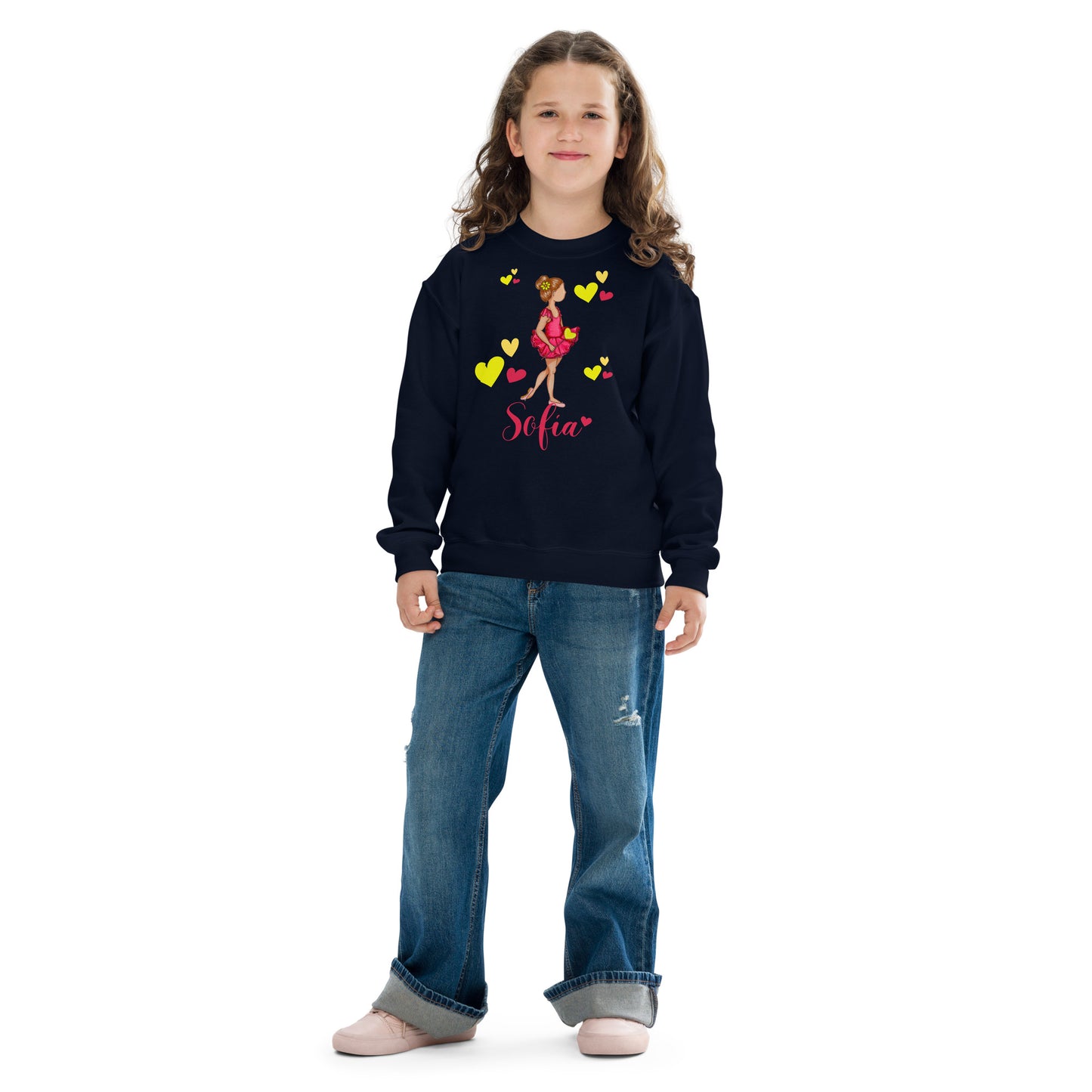 a young girl wearing a black sweatshirt with hearts and a name on it